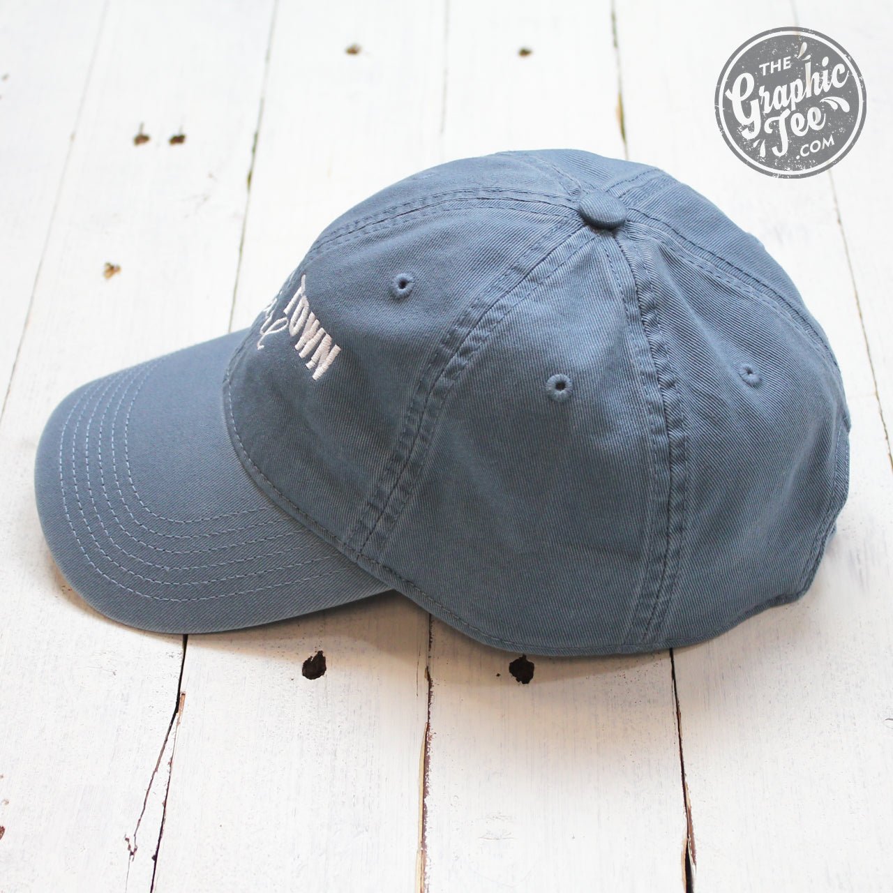 Lake blue relaxed twill dad hat featuring "Small Town Girl" embroidery, stylish cap by The Graphic Tee.