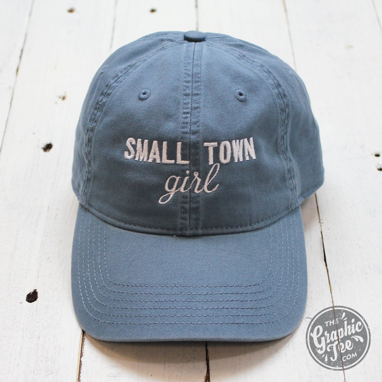 Lake blue relaxed twill dad hat with Small Town Girl graphic, stylish cap by The Graphic Tee featuring a casual, comfortable fit.