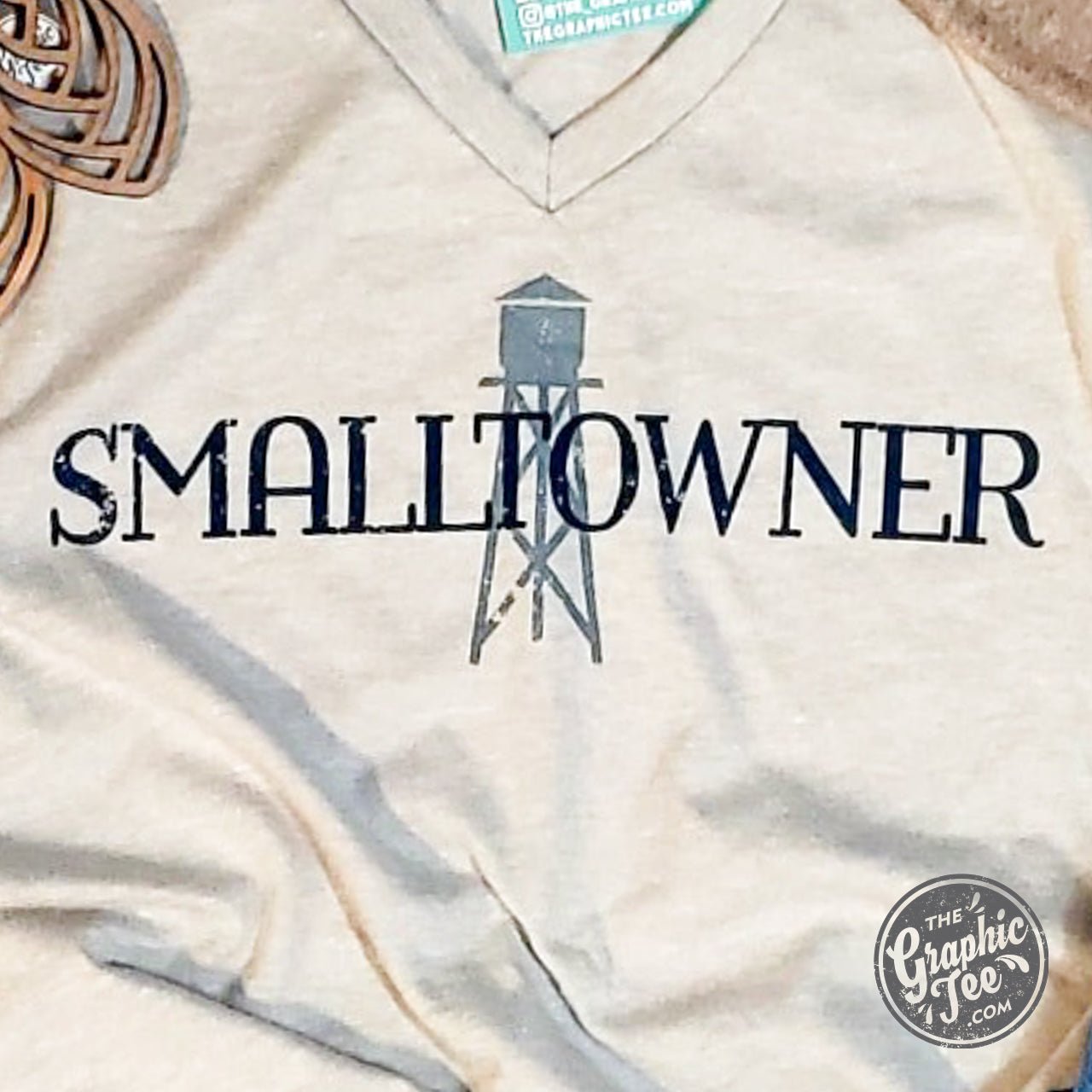 Unisex Smalltowner V-Neck SS Graphic Tee by The Graphic Tee, showing a comfortable fit and stylish design on a plain background.