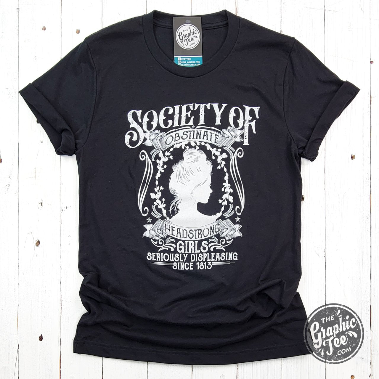 Society of Obstinate Headstrong Girls short sleeve crew neck graphic tee by The Graphic Tee, featuring bold printed design on white fabric.