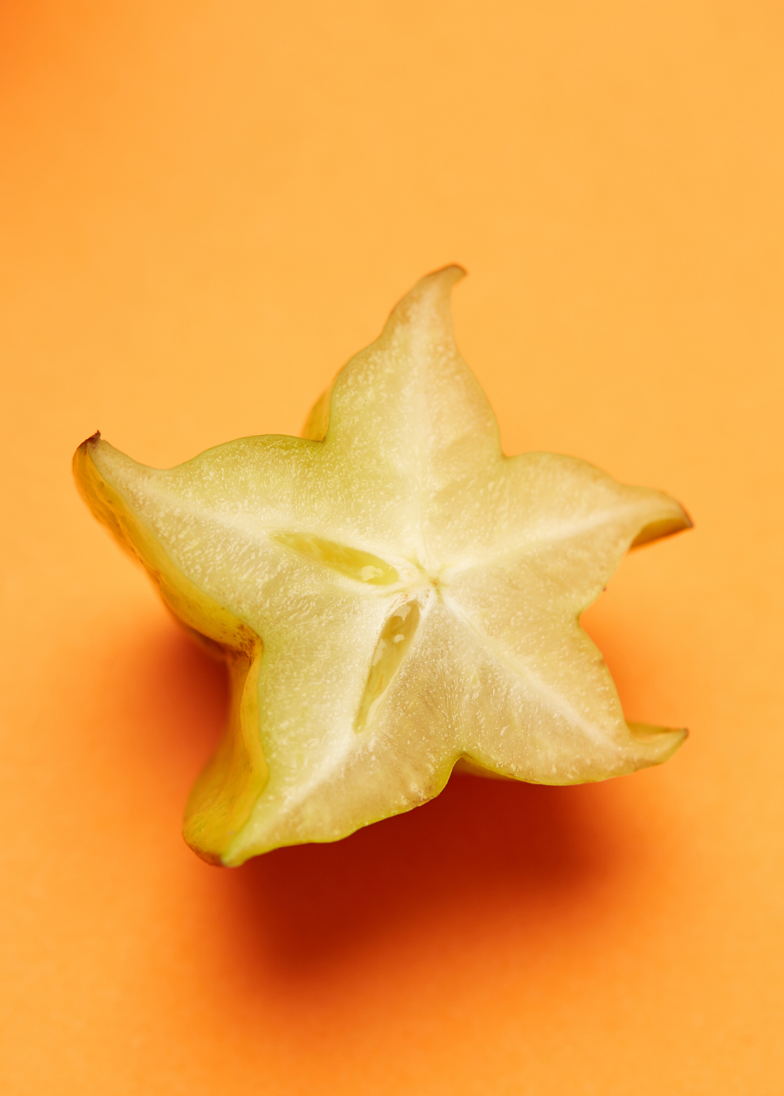 Star Fruit 'Kajang' tropical fruit tree in a large coconut coir pot, showcasing lush green star-shaped fruit and healthy foliage.