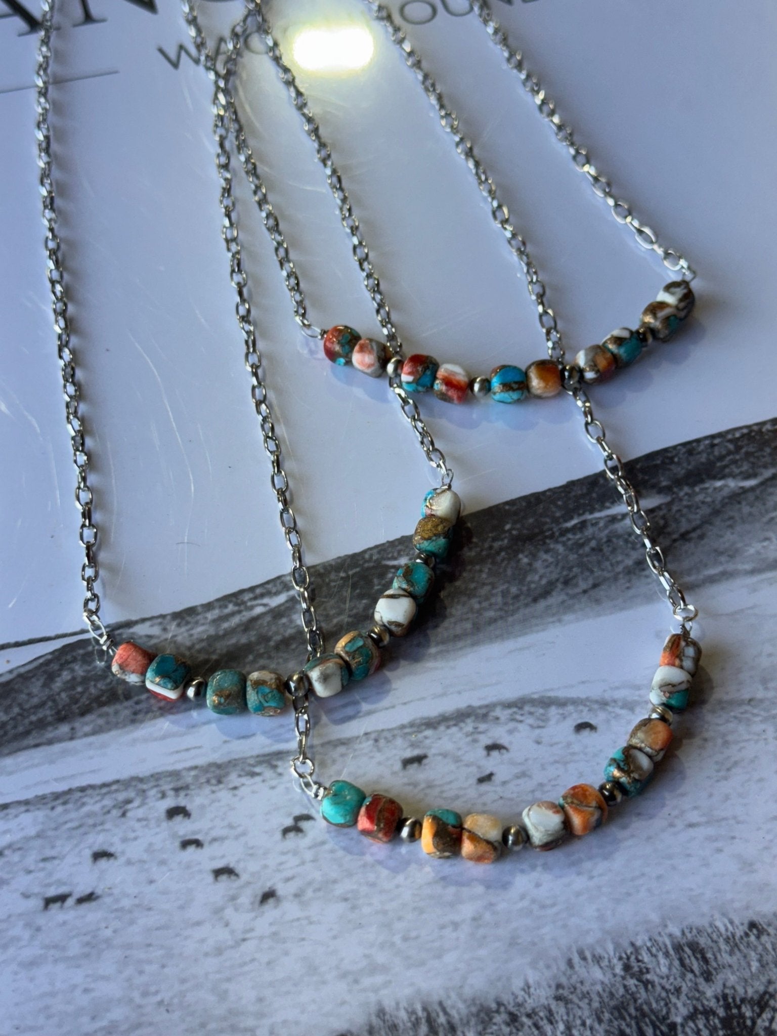 Spiny oyster and turquoise beaded chain necklace by Wild Junkie, featuring vibrant, handcrafted jewelry with colorful beads.