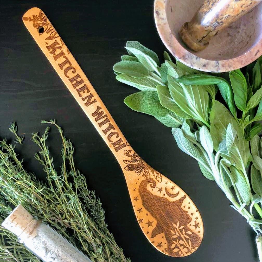 Set of three witchy bamboo wooden spoons for kitchen use, crafted by Spirit Nest, with carved mystical designs.