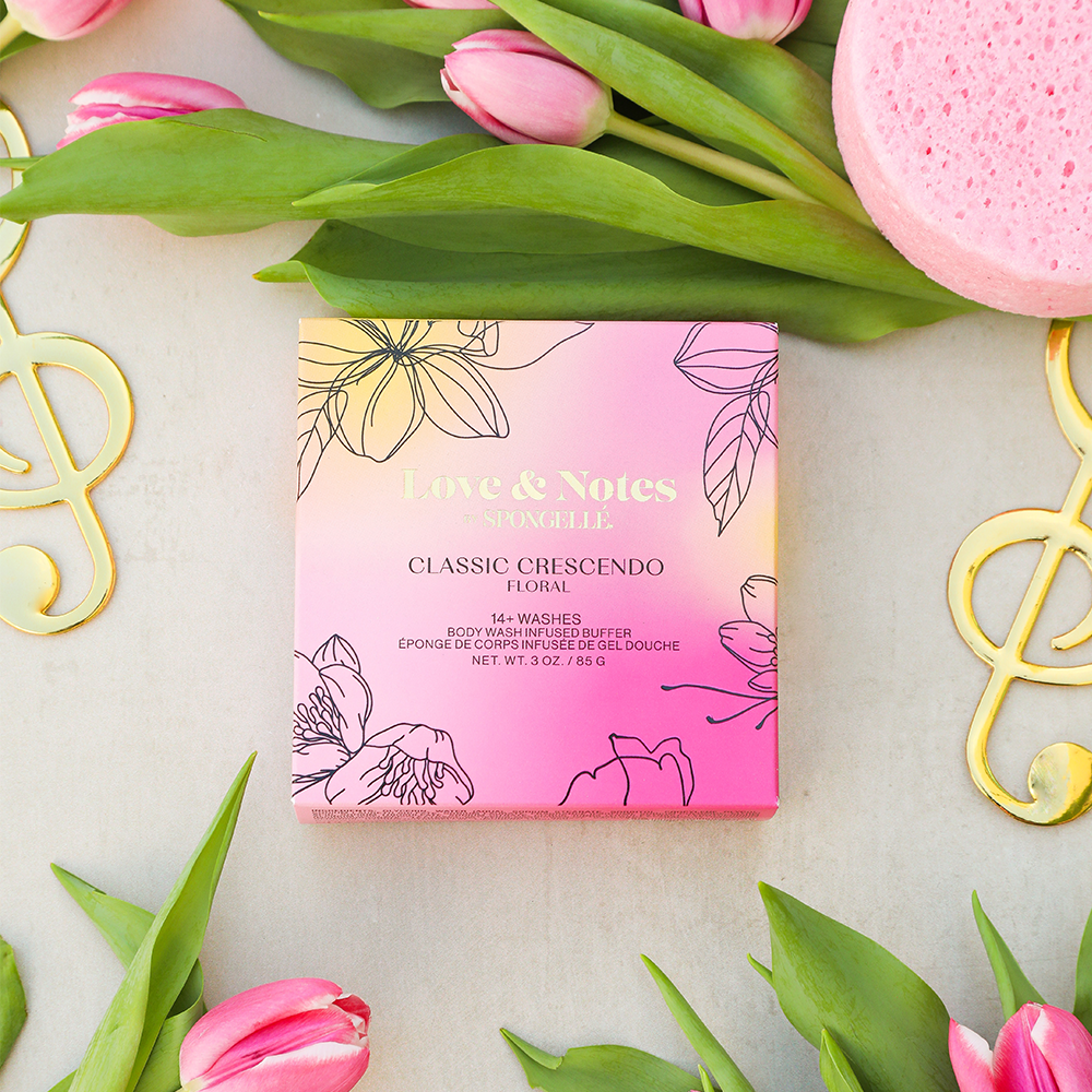 Spongellé Classic Crescendo Love & Notes Body Buffer infused with body wash, featuring a textured sponge design for gentle cleansing.