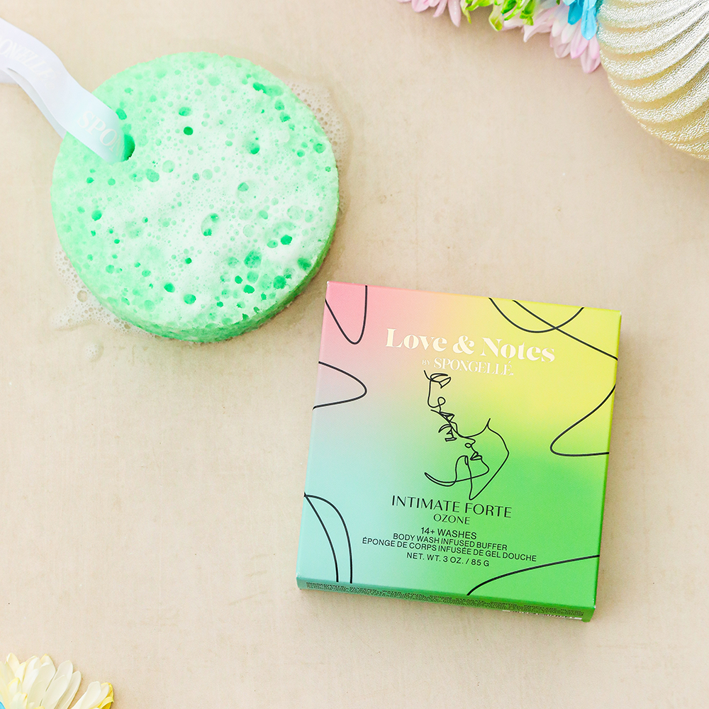 Spongellé Intimate Forte Love & Notes body wash-infused buffer with floral and herbal scent, textured for gentle exfoliation.