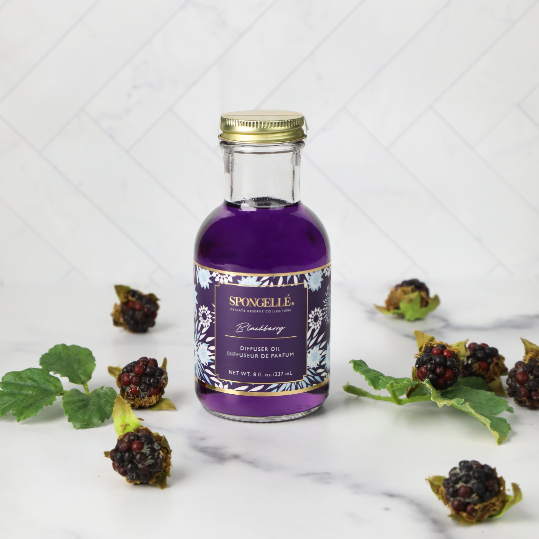 Spongellé Blackberry Diffuser Oil from Private Reserve Collection, a home fragrance with a rich blackberry scent in a decorative bottle.