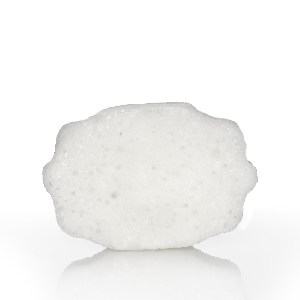 Spongellé Sweet Patchouli Pedi Buffer for exfoliating and softening feet with floral patchouli scent.