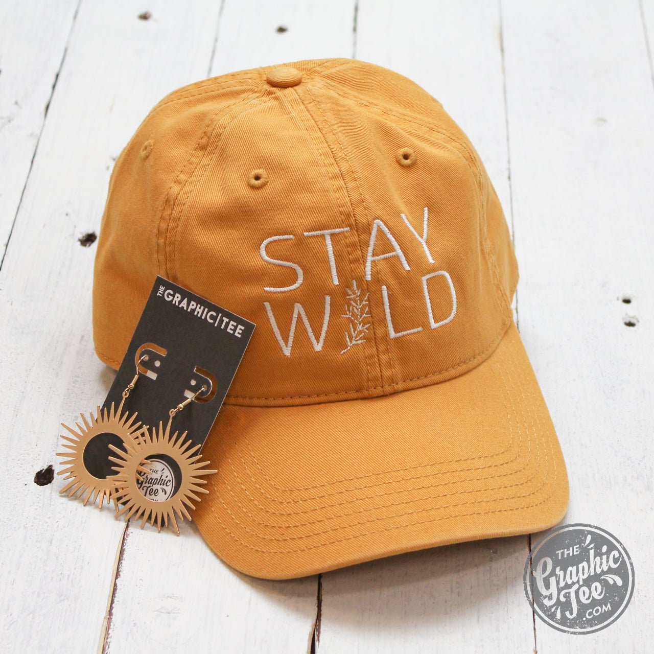 Relaxed fit mustard twill dad hat with "Stay Wild" embroidered text, casual cap style from The Graphic Tee brand
