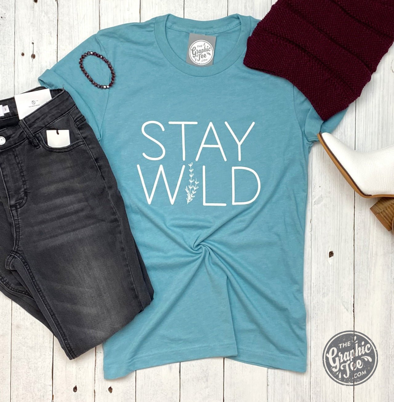 Stay Wild SS Graphic Tee by The Graphic Tee featuring a bold, nature-inspired design on a casual T-shirt.