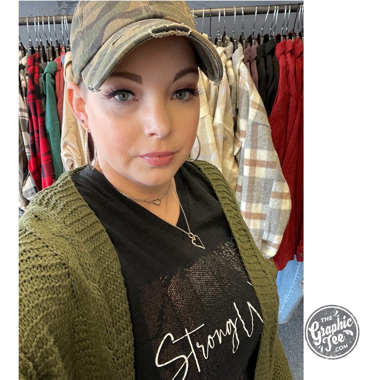 Women wearing a Strong Women V Neck Tee from The Graphic Tee, featuring a casual SS Graphic Tee style with a fitted V-neck design.