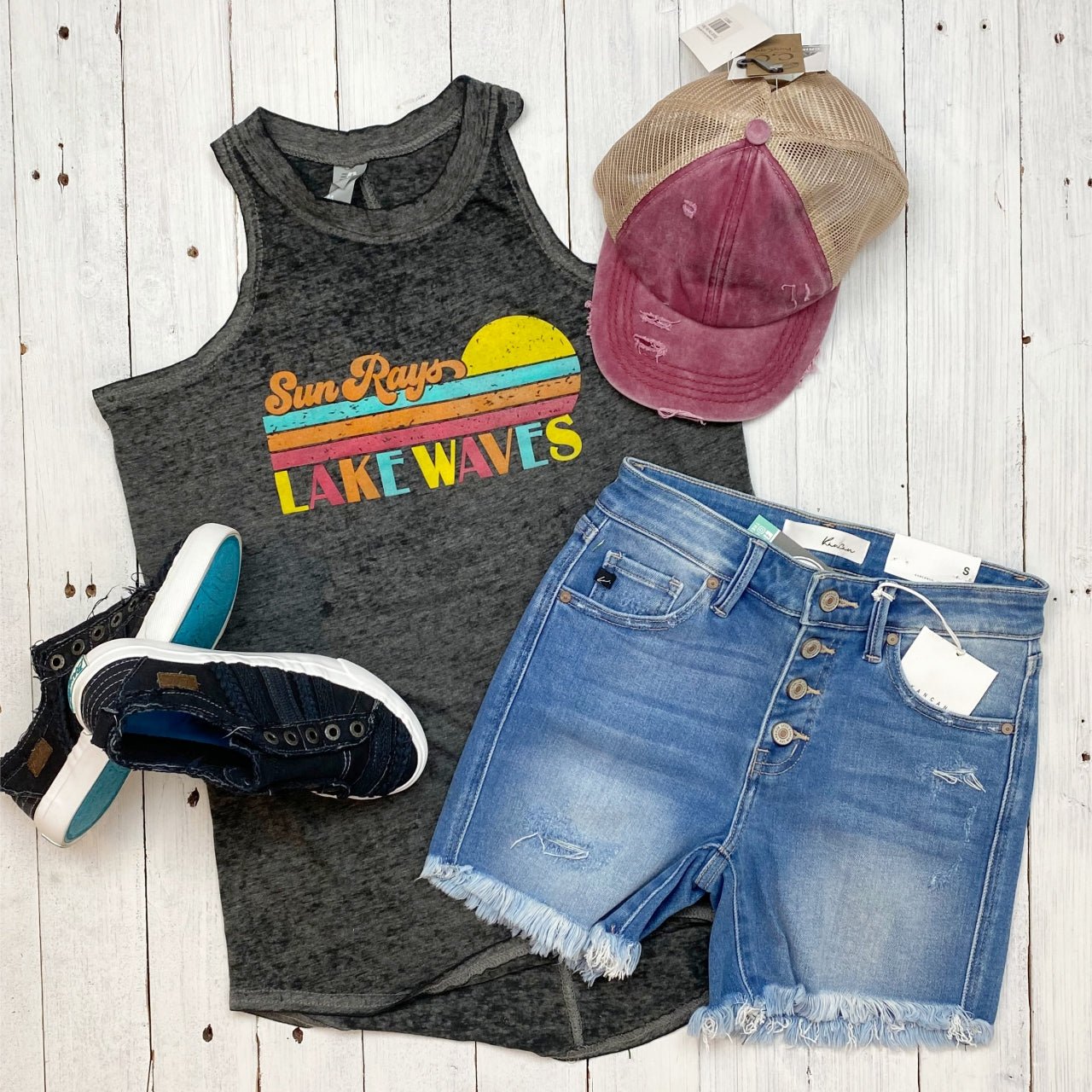 Women’s graphic tank top featuring sun rays and lake waves design by The Graphic Tee