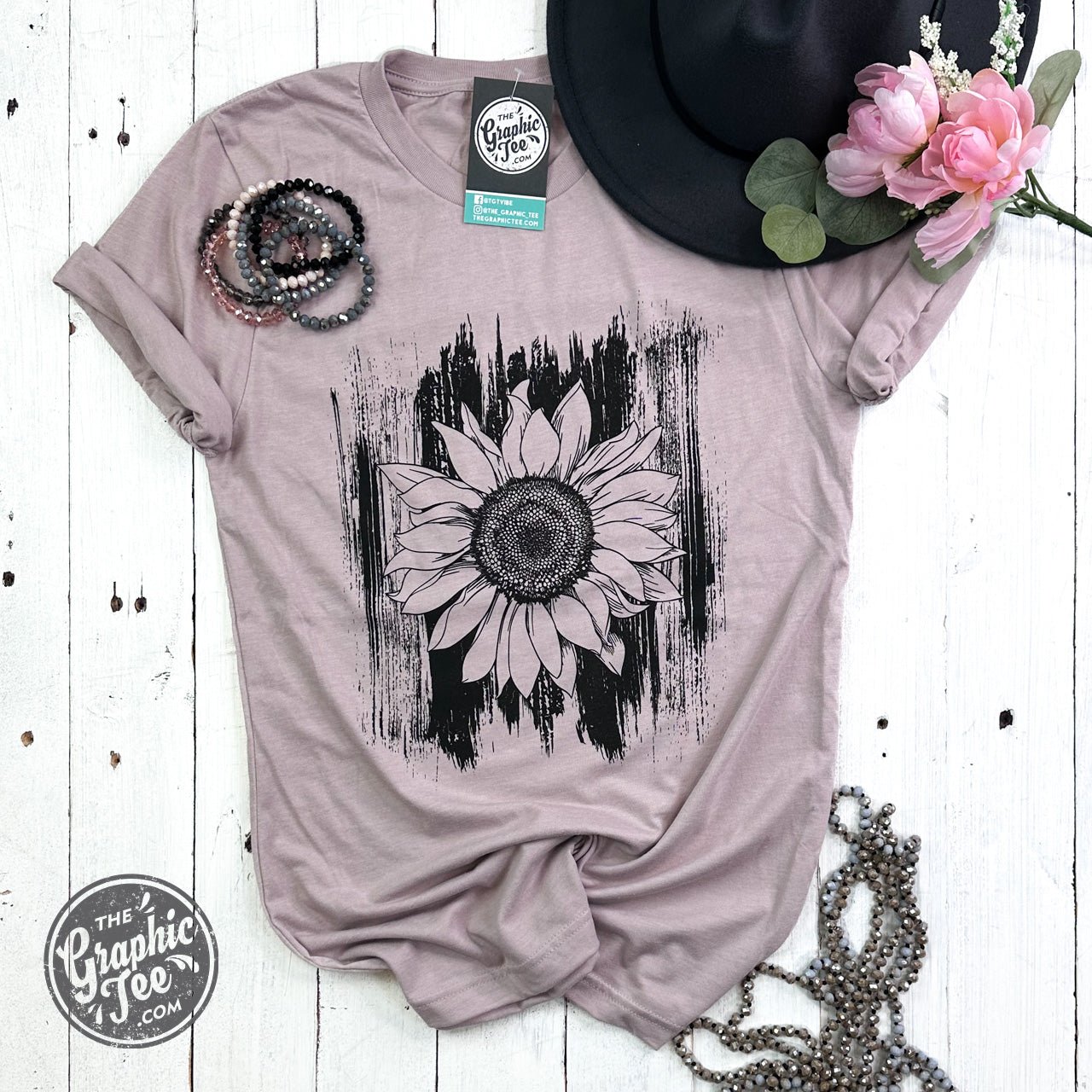 Sunflower with brush strokes design on The Graphic Tee SS graphic crewneck shirt, showcasing vibrant floral artwork.