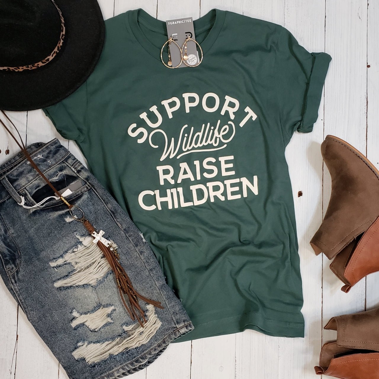 Unisex SS Graphic Tee by The Graphic Tee supporting wildlife conservation and raising children, featuring a nature-inspired design.