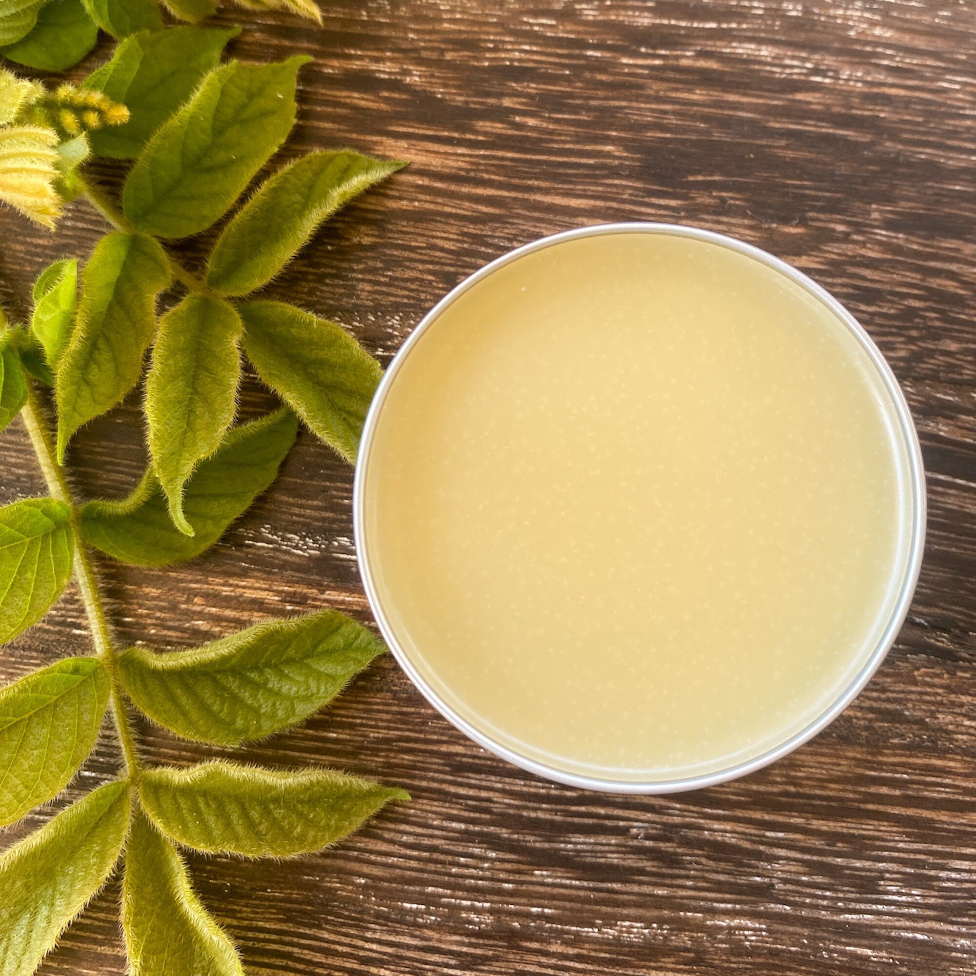 Lavender balm by Sweet ʻŌkole Soap, calming essential oil salve in a small jar with lavender flowers and herbal ingredients.