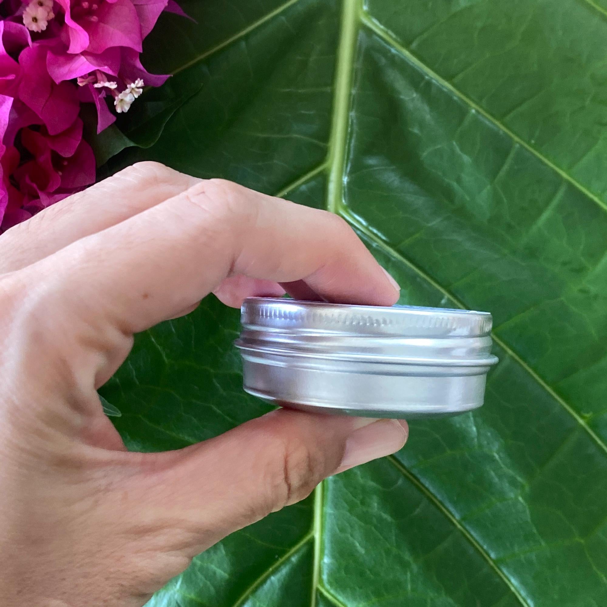 Lavender balm by Sweet ʻŌkole Soap, a calming essential oil salve in a small jar with lavender flowers and herbal ingredients.