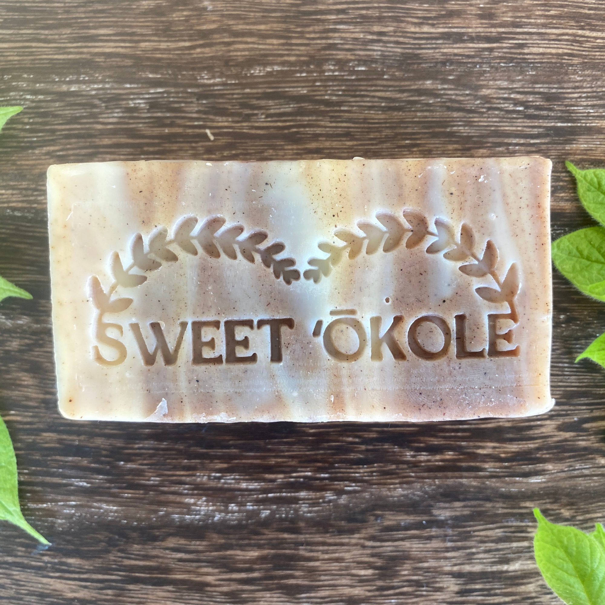 Bar of Neem Bark and Patchouli Soap with Shea Butter from Sweet ʻŌkole Soap, showing a natural soap bar with botanical ingredients.
