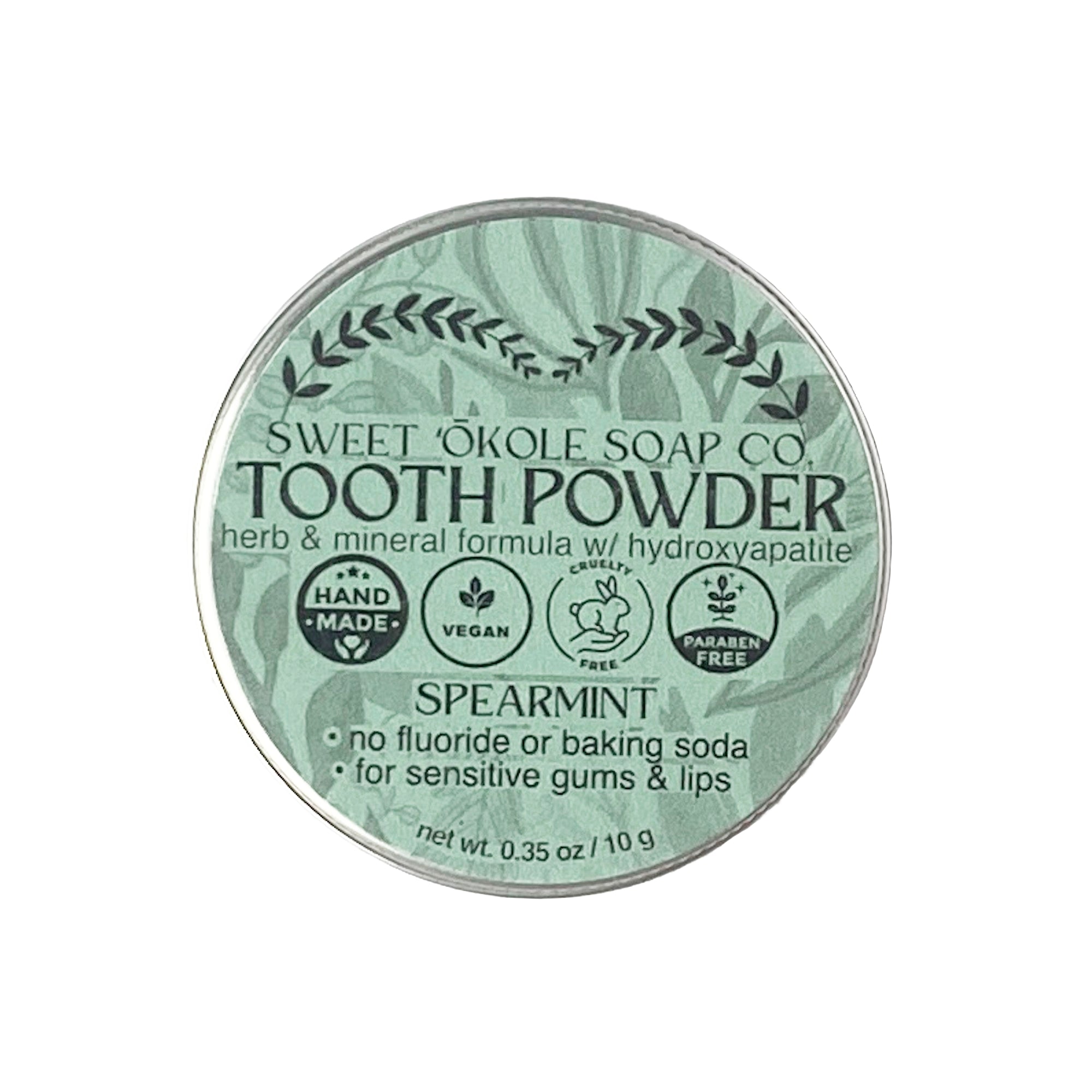 Spearmint Tooth Powder with Noni and 5% Hydroxyapatite by Sweet ʻŌkole Soap, showing the powder in a jar with mint leaves.