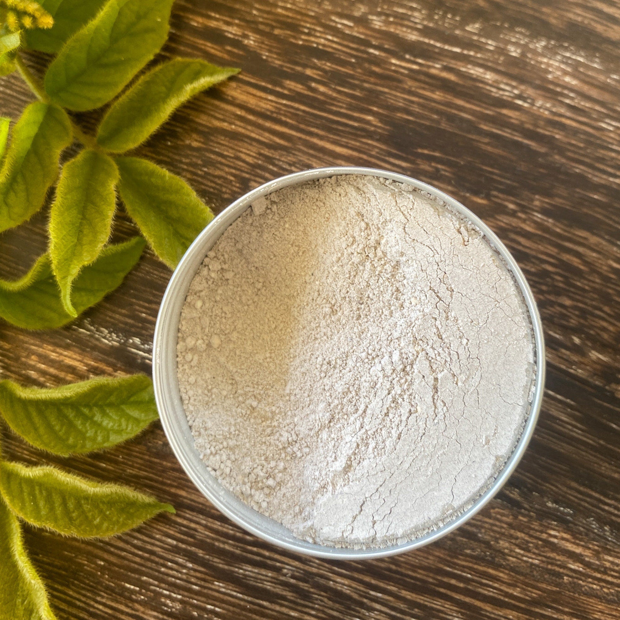 Unflavored natural tooth powder by Sweet ʻŌkole Soap, microbiome-friendly for sensitive teeth, gums, and lips, in a clear jar.