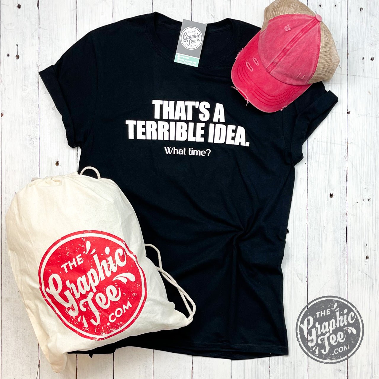Adult graphic t-shirt featuring the "That's A Terrible Idea What Time?" design from The Graphic Tee brand.