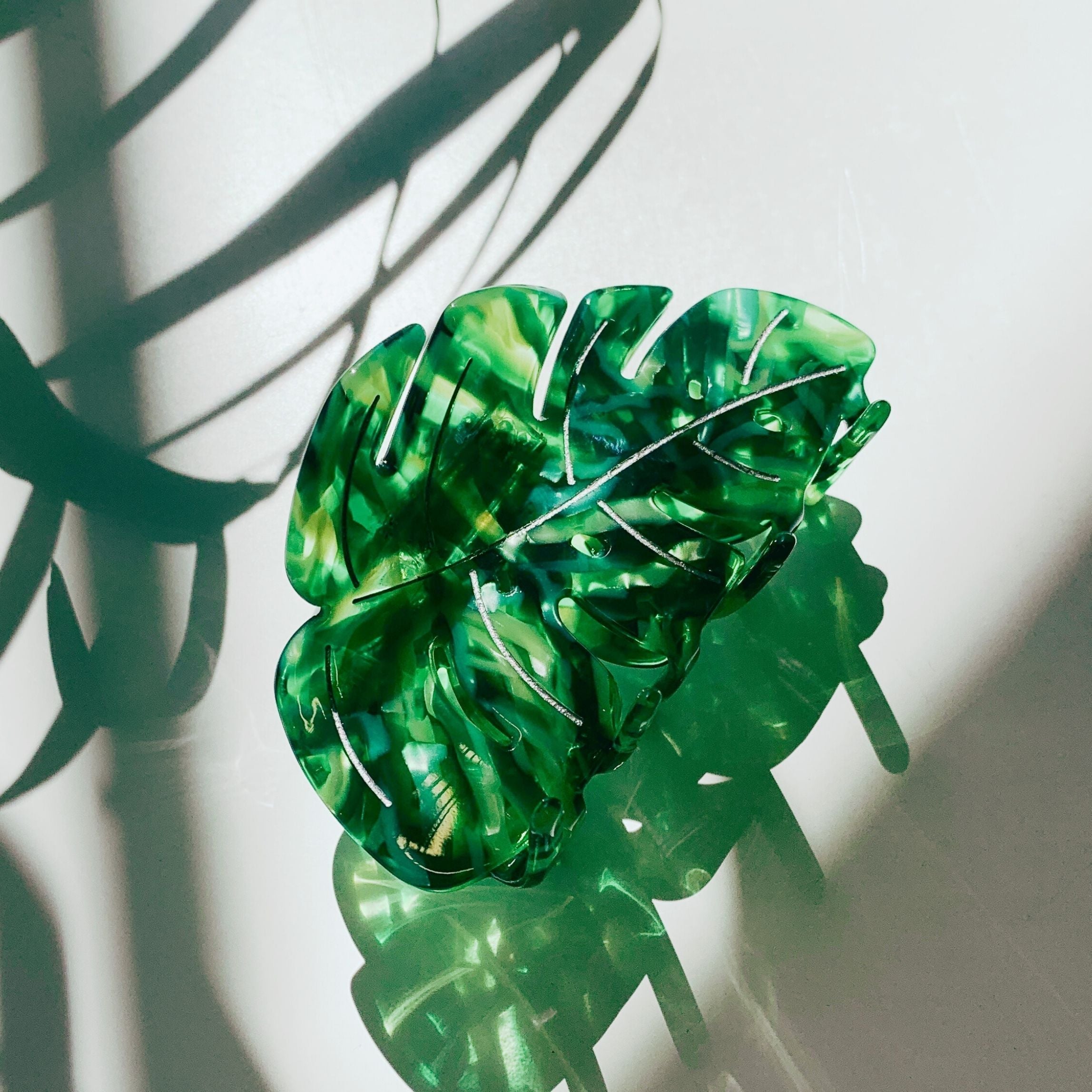 Velvet Claws Monstera leaf hair claw accessory by The Bullish Store, featuring a green monstera leaf design with velvet texture.