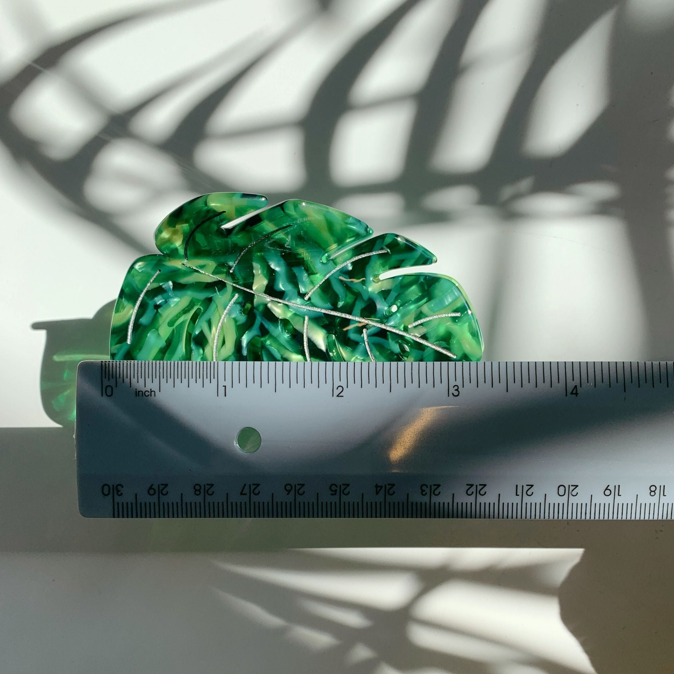 Velvet Claws Monstera leaf hair claw accessory by The Bullish Store, featuring a green monstera leaf design on a velvet hair clip.