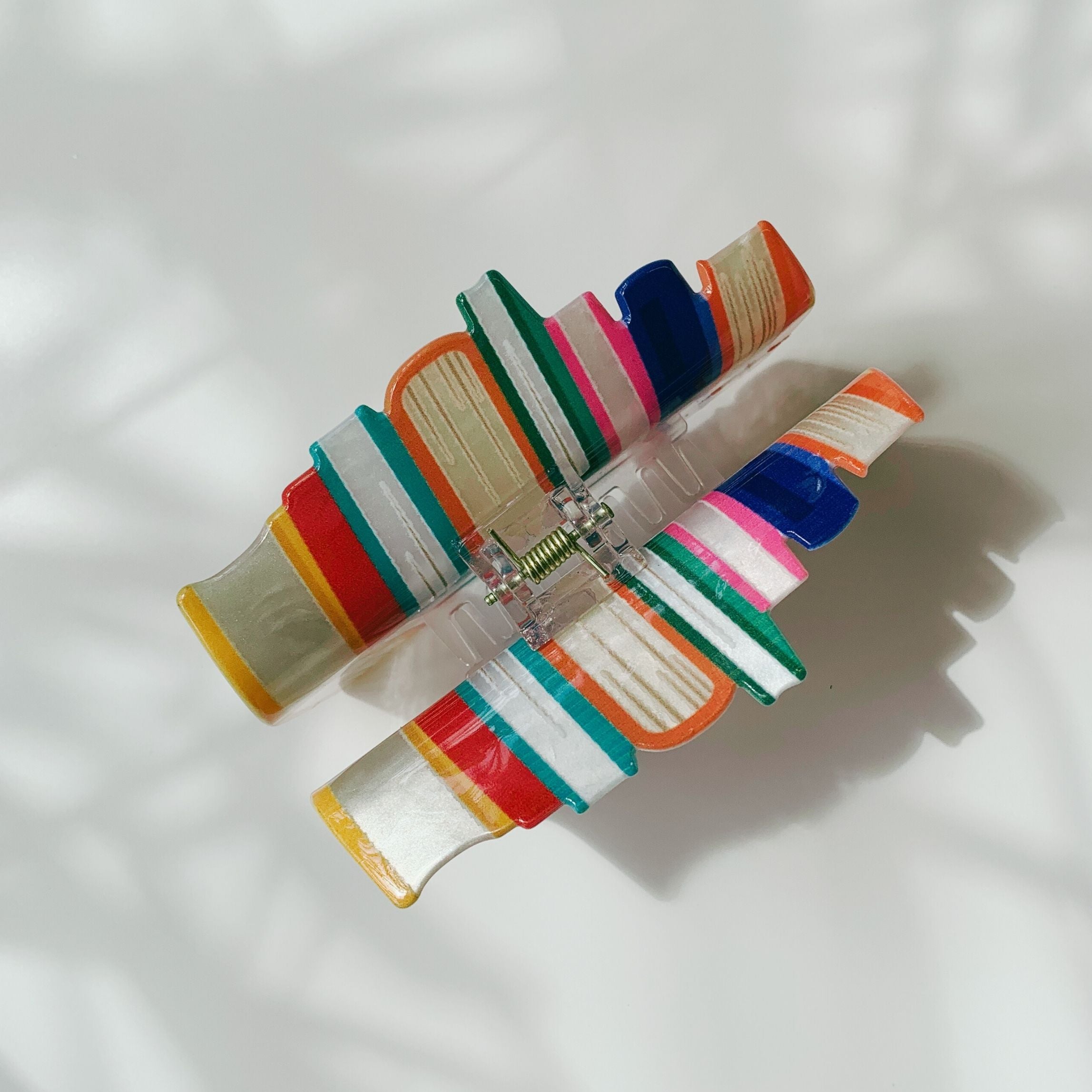 Velvet Claws stack of books hair clip by The Bullish Store, featuring velvet claw design, perfect for stylish hair accessories.