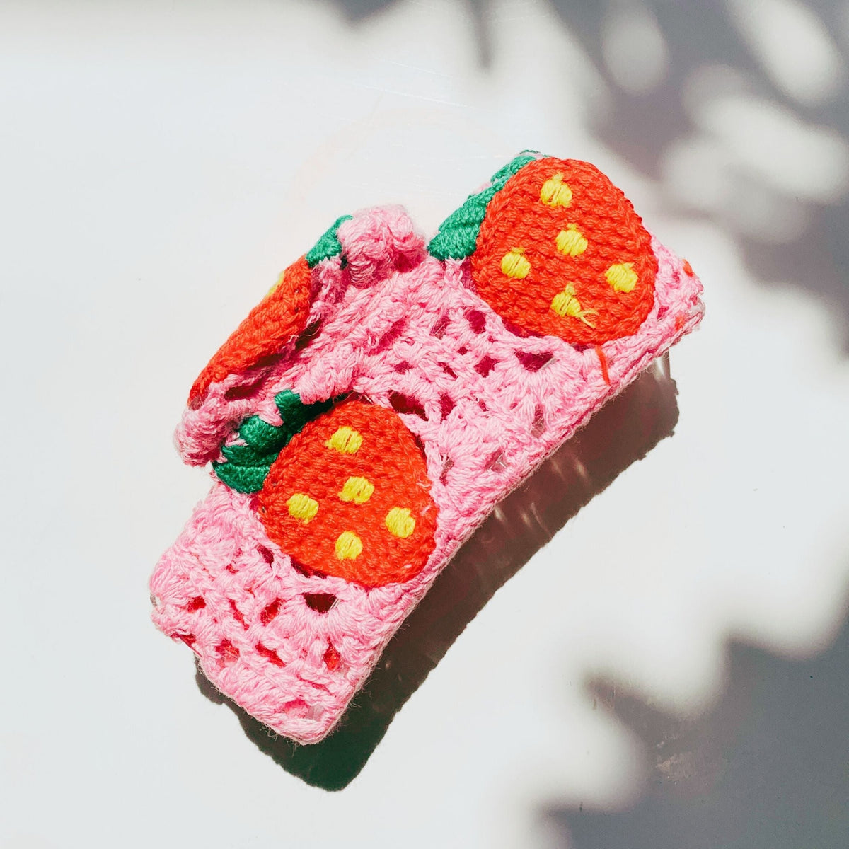 Velvet Claws strawberry granny square hair claw from The Bullish Store, floral accessory for stylish hair styling.