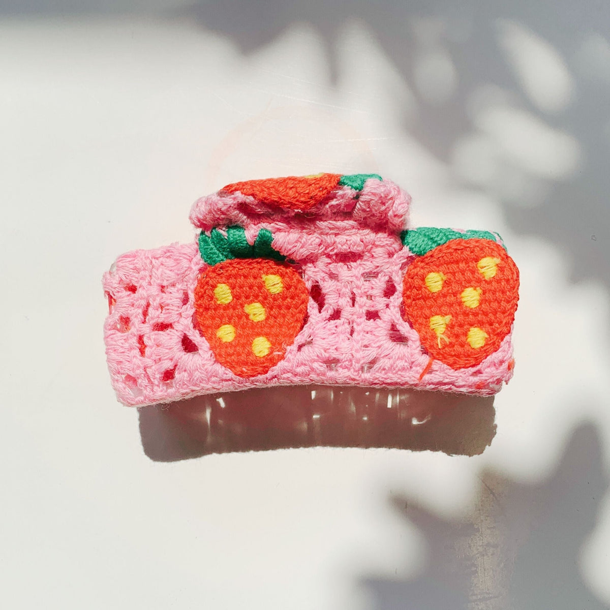 Velvet Claws Strawberry Granny Square Hair Claw from The Bullish Store, featuring a colorful crochet pattern accessory for hair.