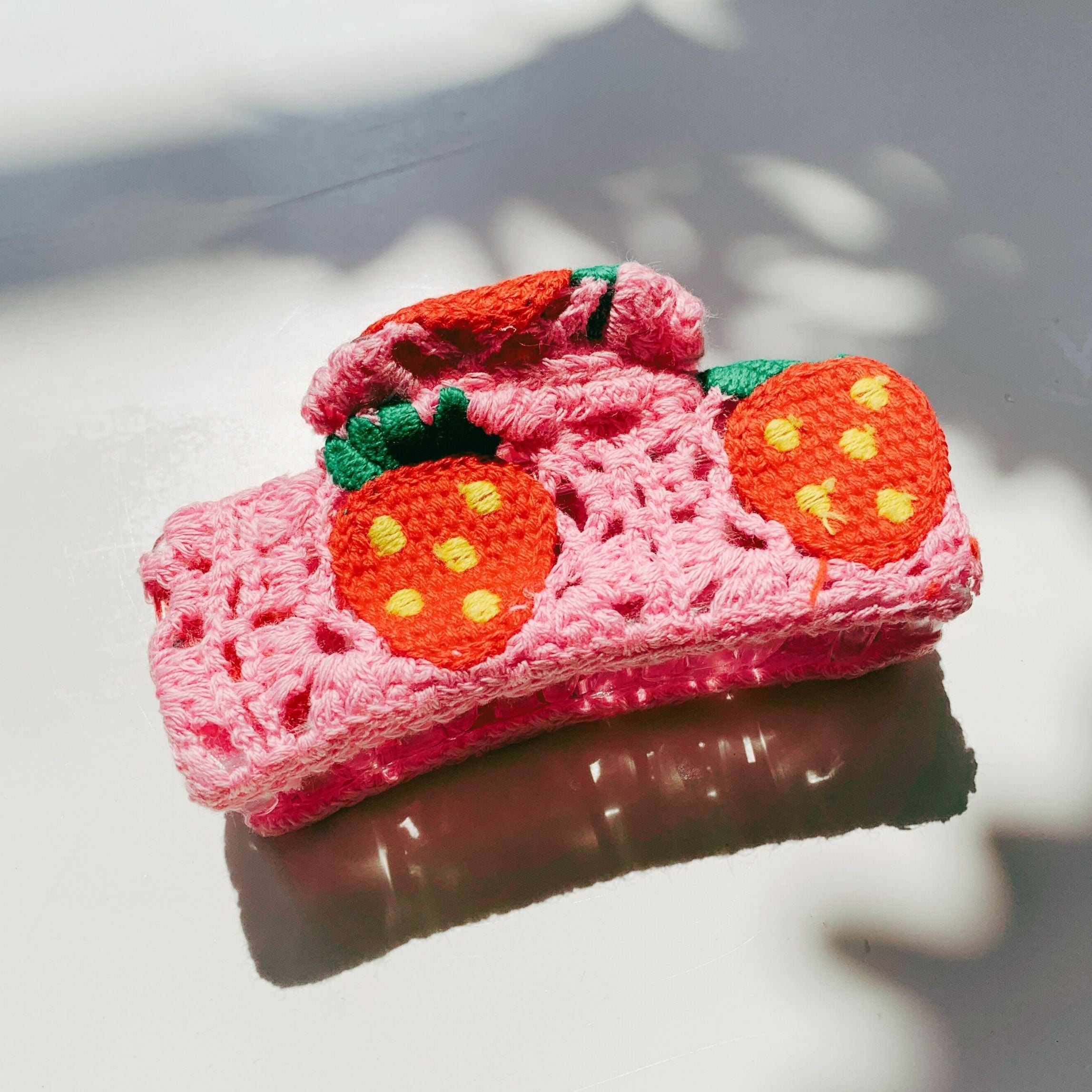 Velvet Claws Strawberry Granny Square Hair Claw from The Bullish Store featuring a colorful, textured granny square design.