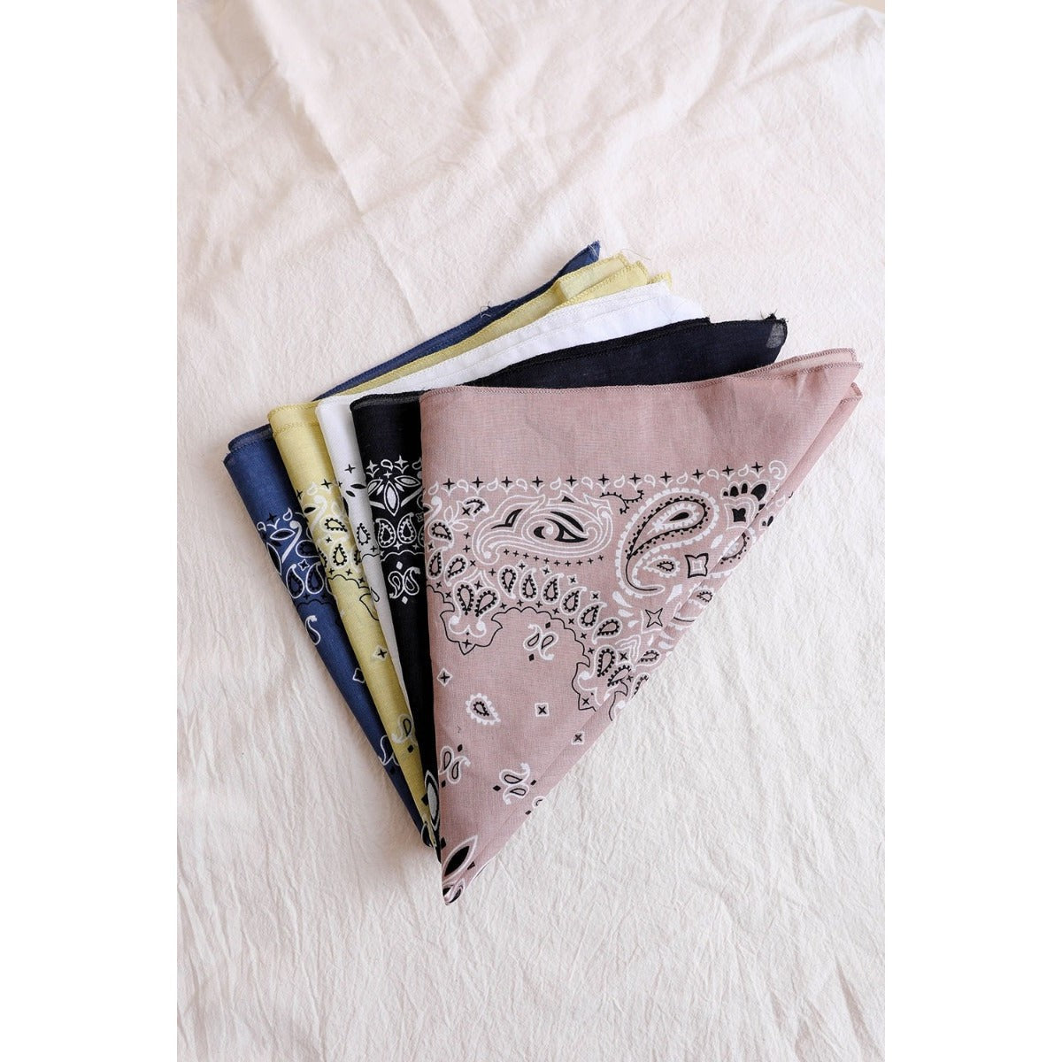 Dusty rose muted color boho hair scarf headband, made of fabric, styled as a versatile bandana or head tie.