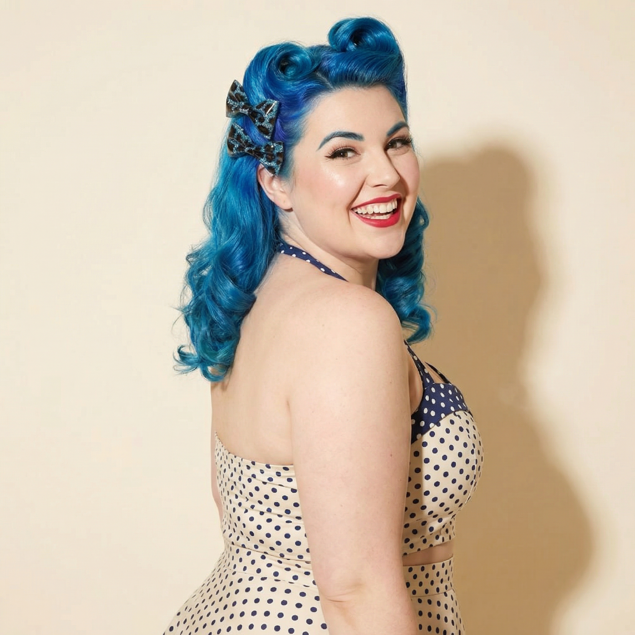 Set of two Sourpuss blue leopard glitter hair bows, rockabilly hair clips with leopard print design, perfect for vintage hairstyles.