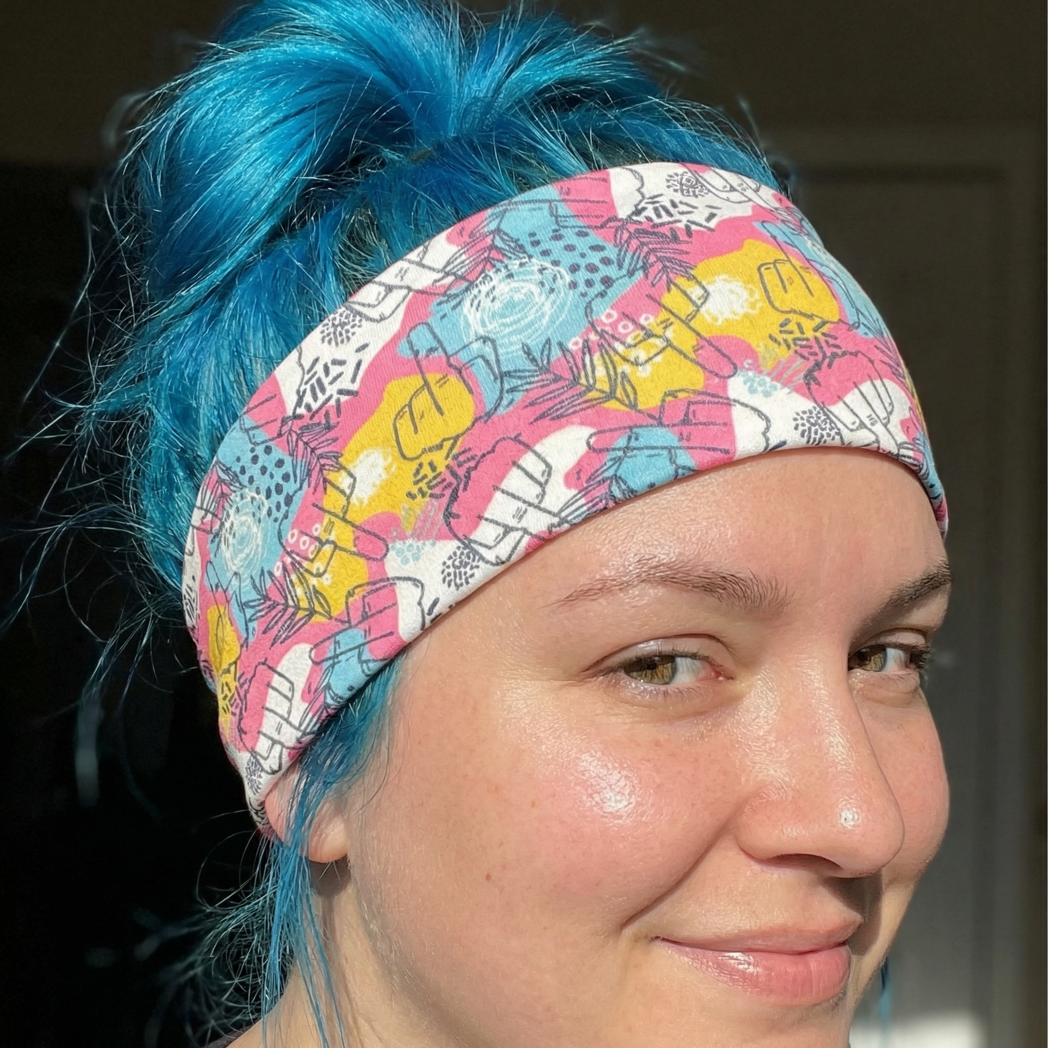 Colorful stretch headband with hidden middle finger design, fun hair accessory from The Bullish Store featuring bold, humorous graphics.