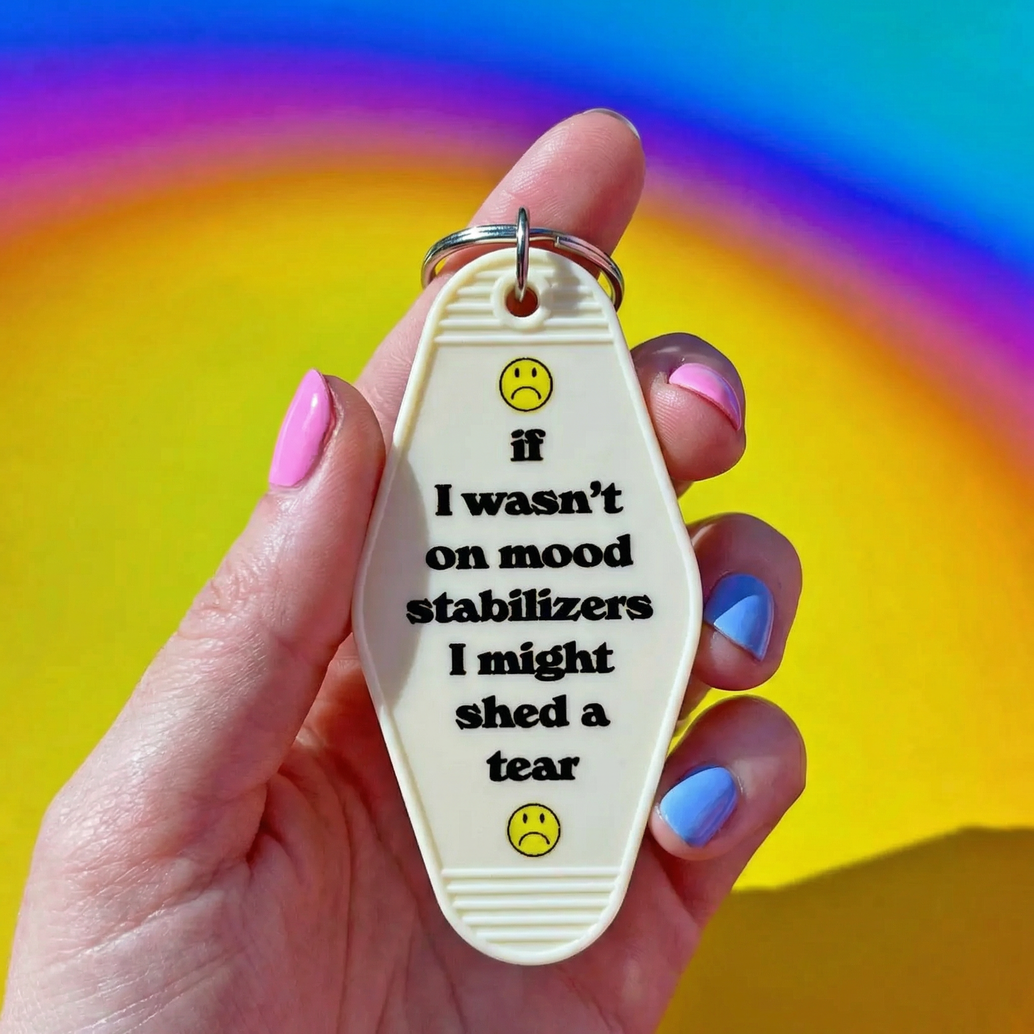 White vintage motel keychain with mood stabilizer design from The Bullish Store, featuring retro motel imagery on a metal keychain.