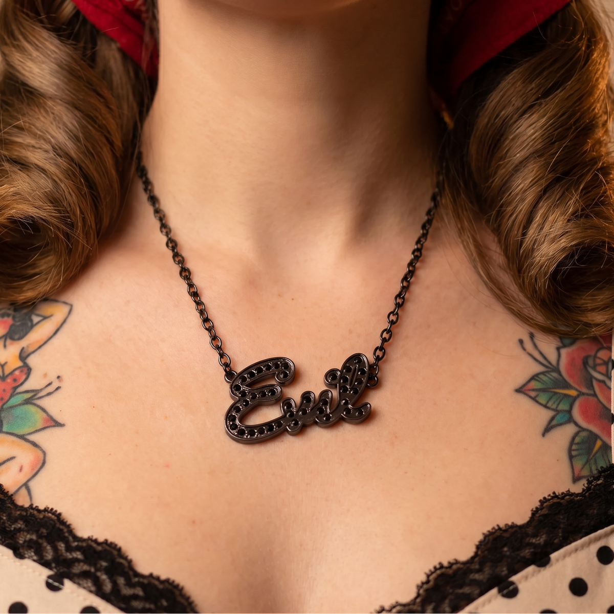 Sourpuss Evil pendant necklace with black rhinestones, Gothic statement jewelry featuring a dark, edgy design.