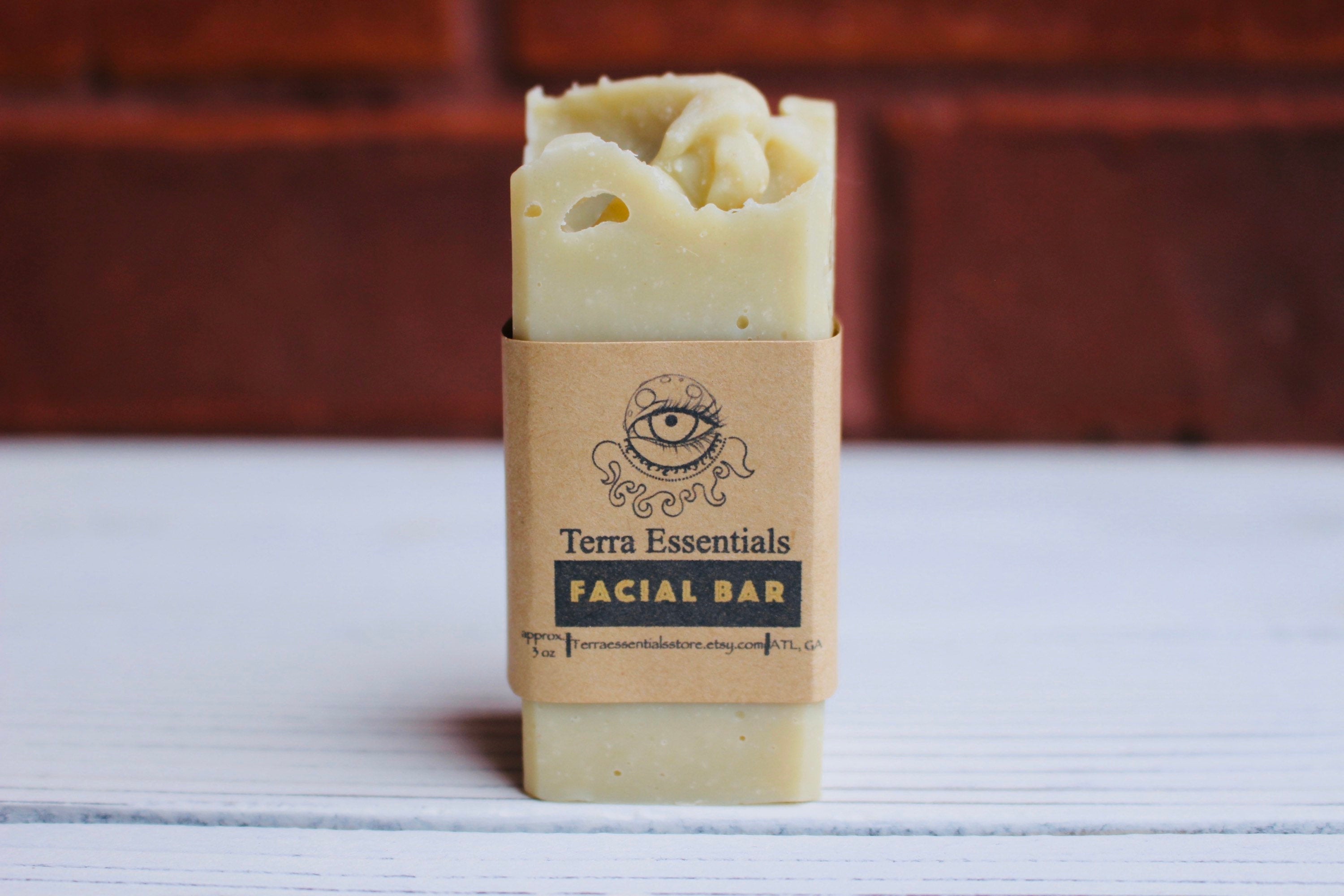 The Earthly Alternative facial bar soap with natural ingredients, featuring a rectangular shape and minimalist packaging.