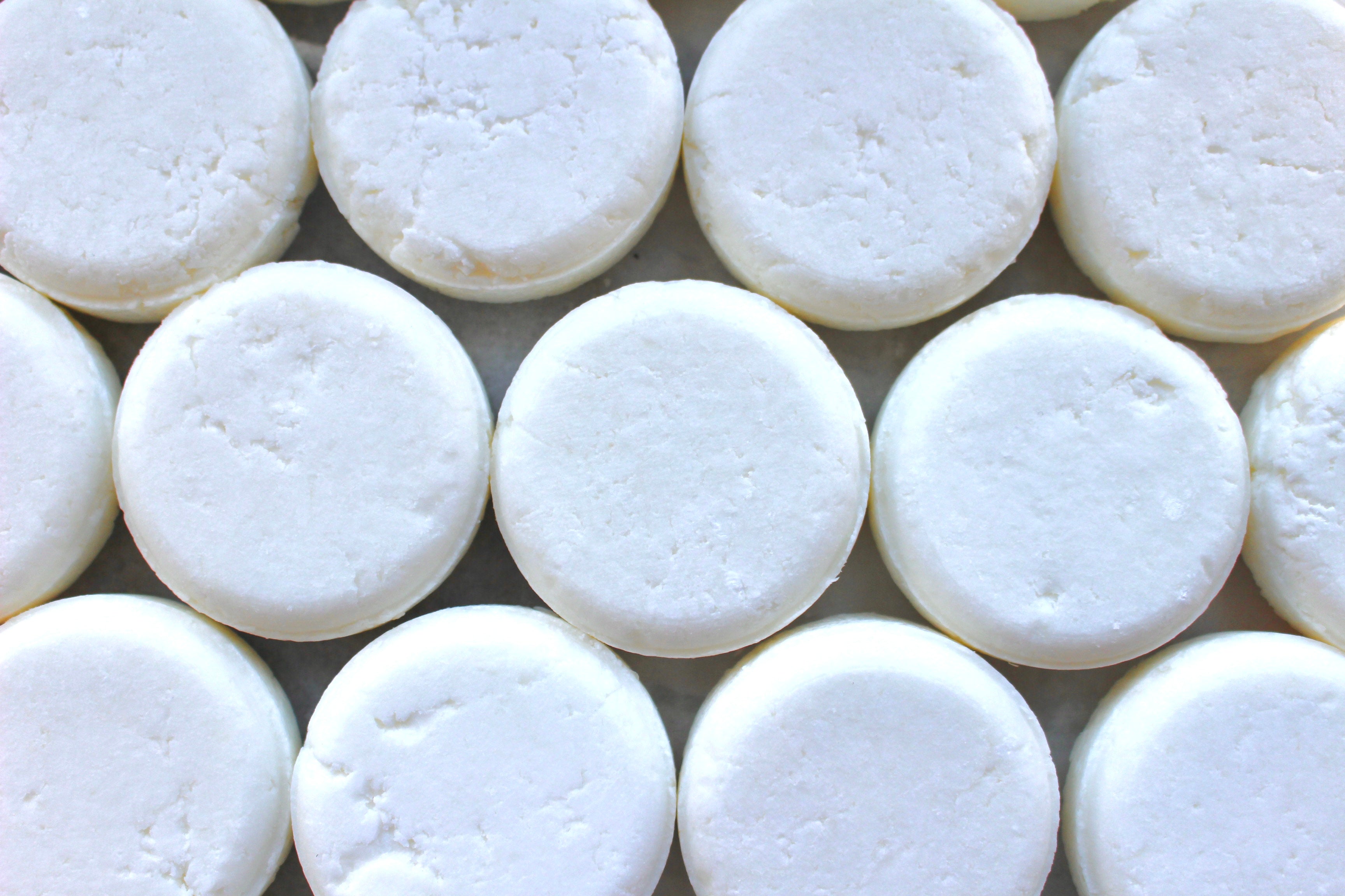 Tingling Tea Tree & Peppermint Shampoo Bar by The Earthly Alternative, showing a natural soap bar with herbal ingredients.