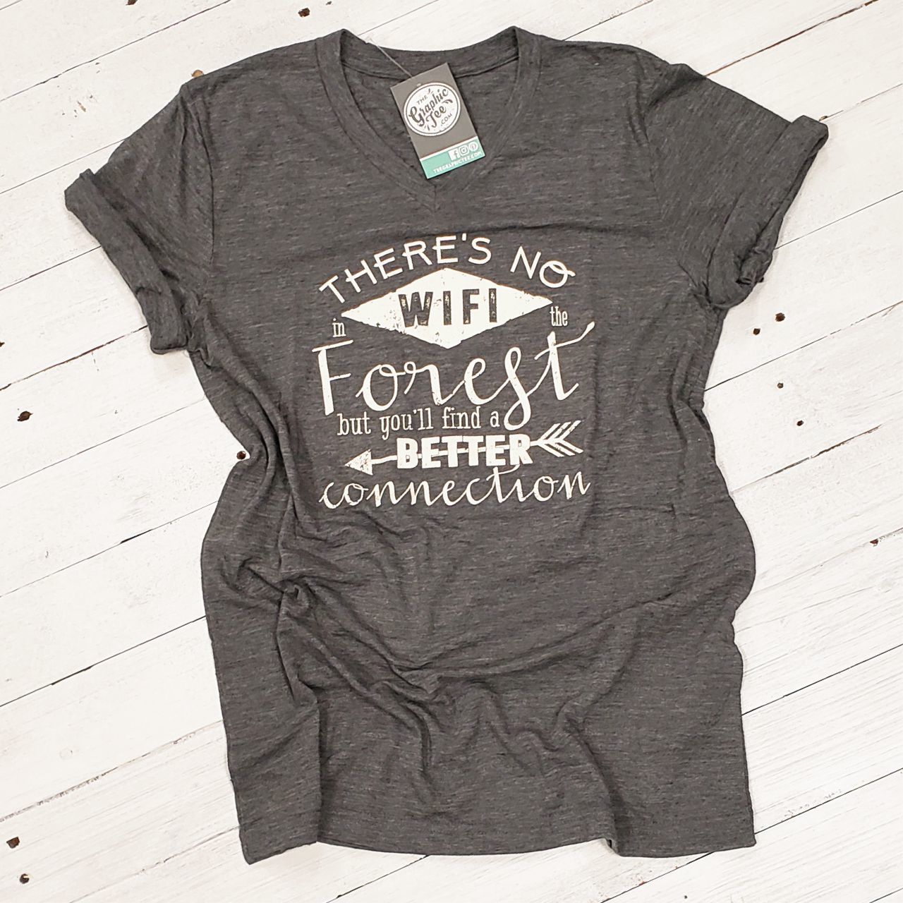 Unisex V-neck graphic tee featuring the message "There's No WIFI in the Forest, but You'll Find a Better Connection" by The Graphic Tee.