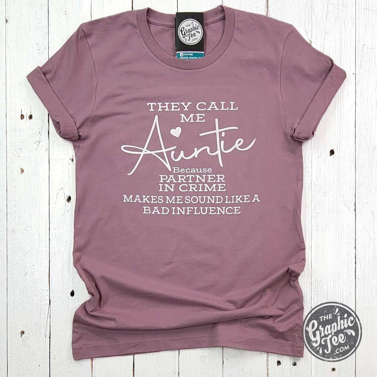 They Call Me Auntie short sleeve graphic tee by The Graphic Tee, featuring a casual, stylish design on a white fabric background.