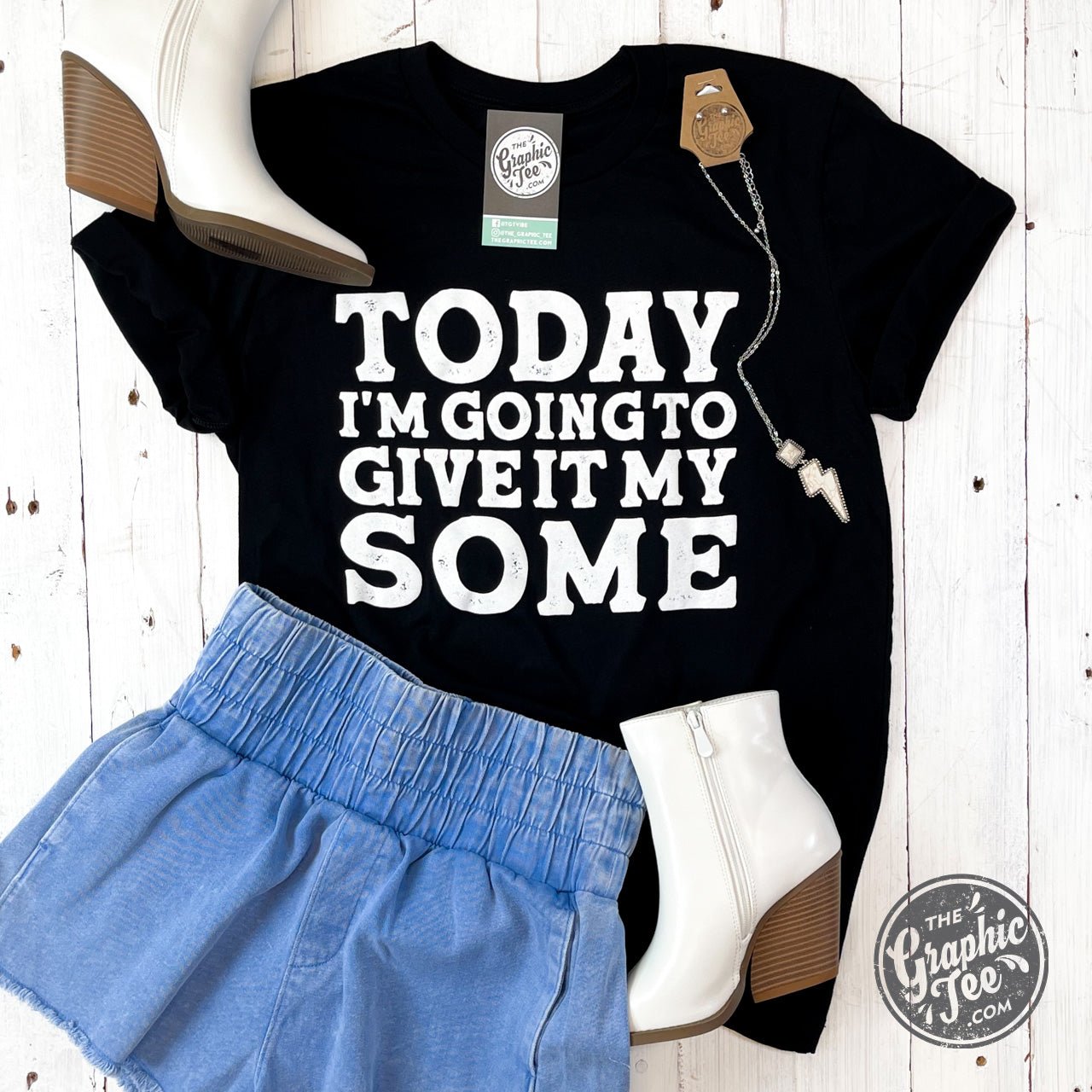 Unisex short sleeve graphic tee by The Graphic Tee with bold print reading "Today I'm Going To Give It My Some" on the front.