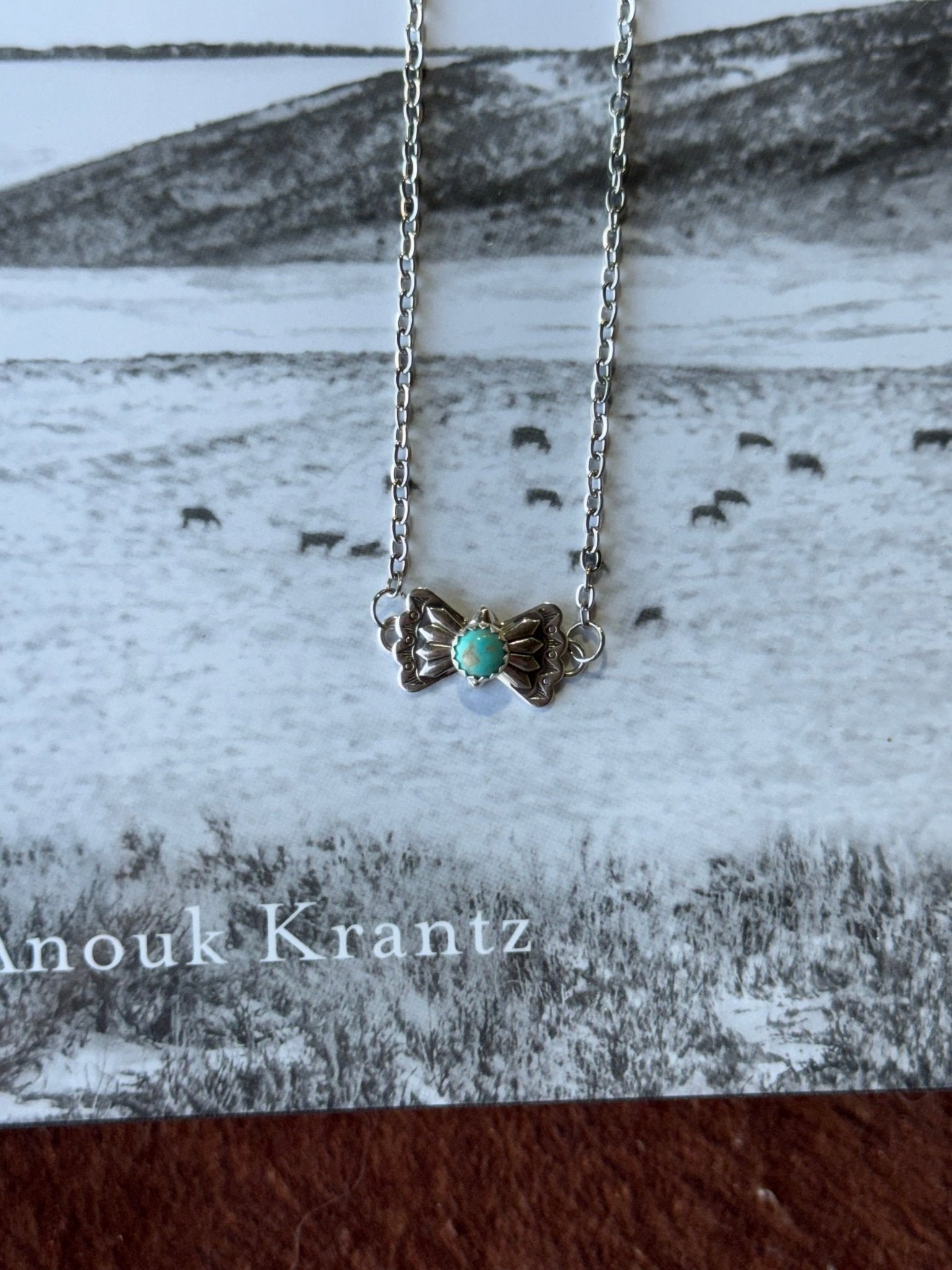 Turquoise butterfly concho chain necklace by Wild Junkie featuring a silver-tone chain with butterfly and concho accents.