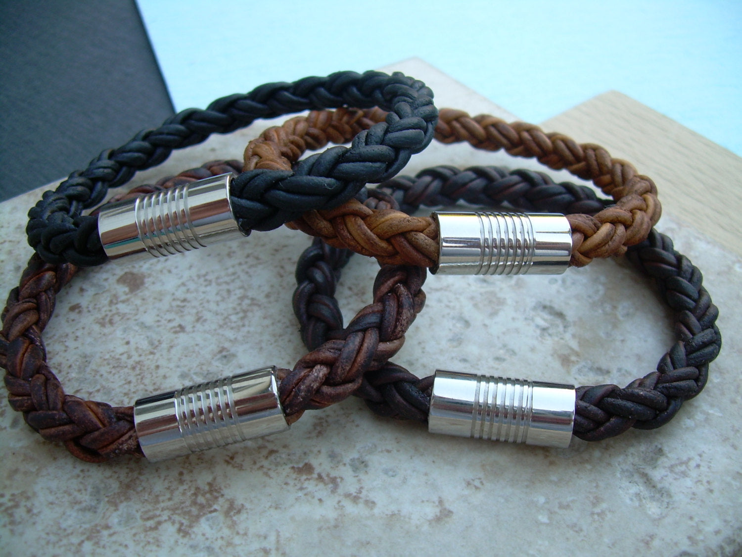 Light brown braided leather men's bracelet with stainless steel magnetic clasp, fits a 7-inch wrist, stylish gift for him.