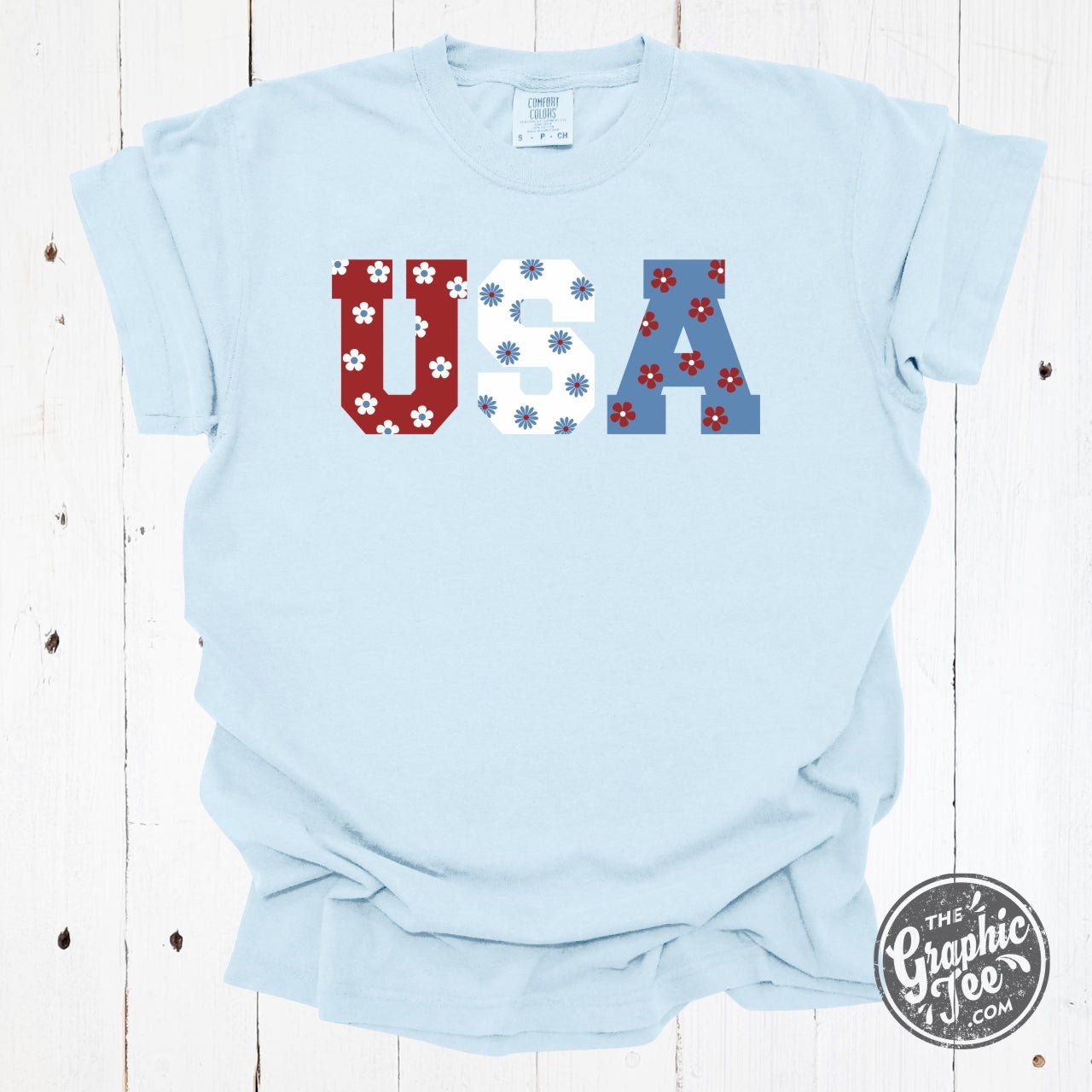 USA 90's inspired floral pigment dyed graphic T-shirt by The Graphic Tee, featuring vibrant 90s floral print and casual fit.