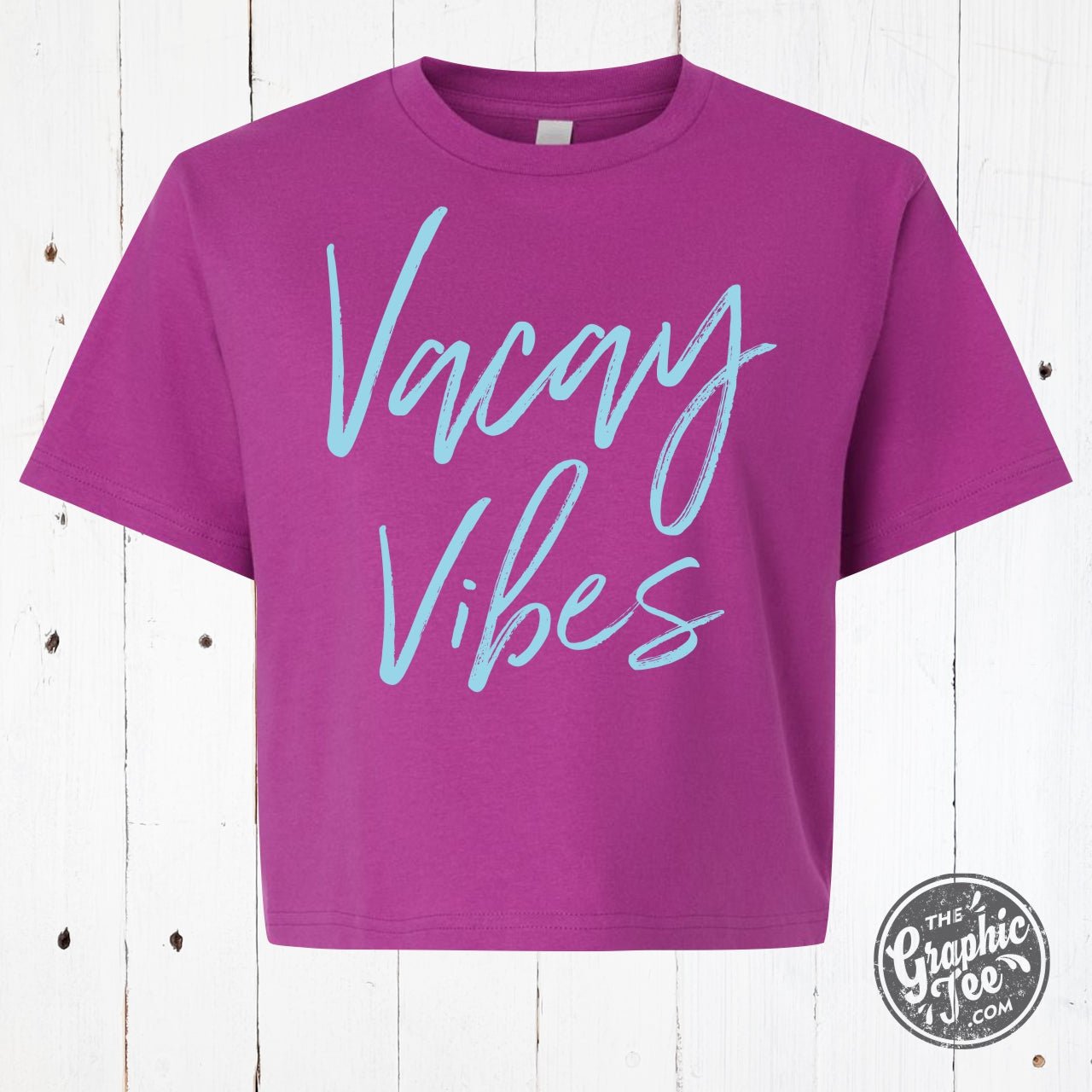 Women's Vacay Vibes boxy graphic tee by The Graphic Tee, featuring a relaxed fit and vibrant vacation-inspired design.