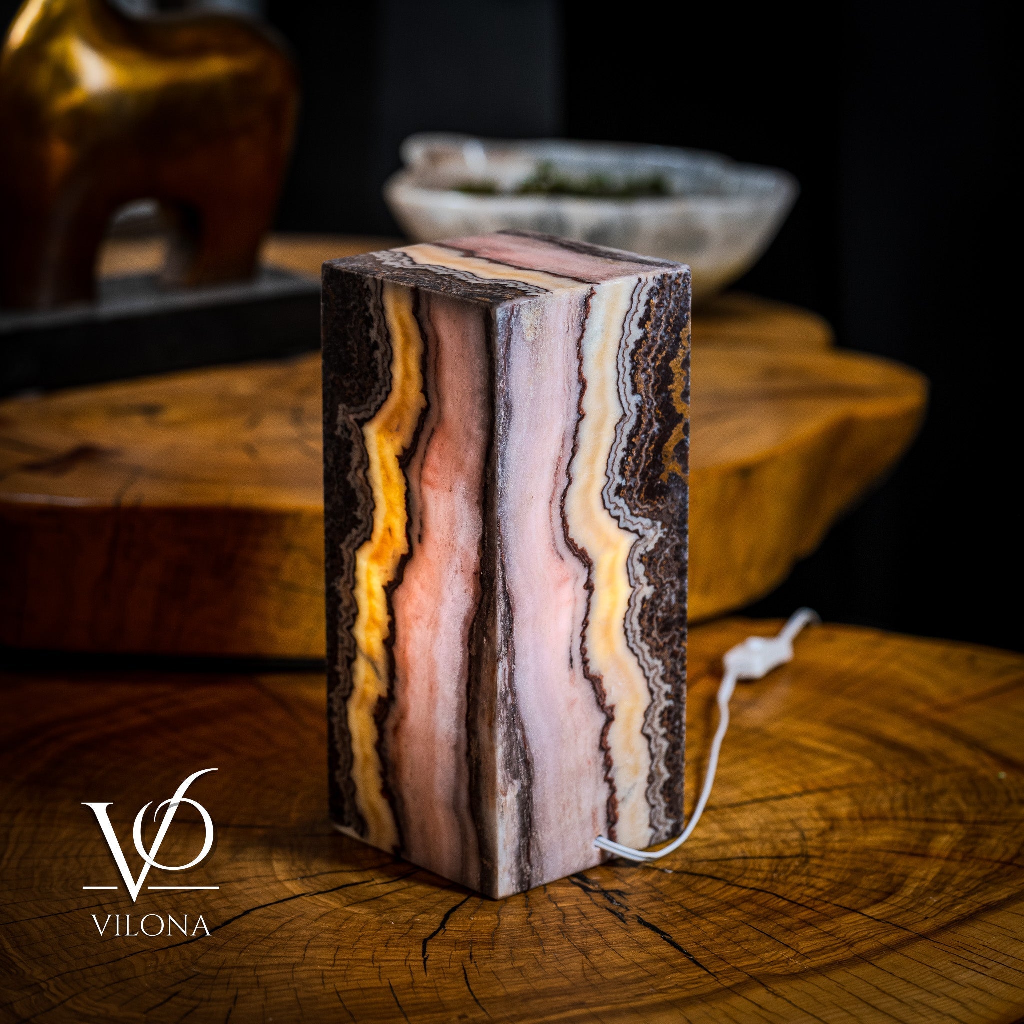 Vilona Onyx Razzberry Rosa Onyx desk lamp with a sleek table lamp design, featuring vibrant pink and purple hues.