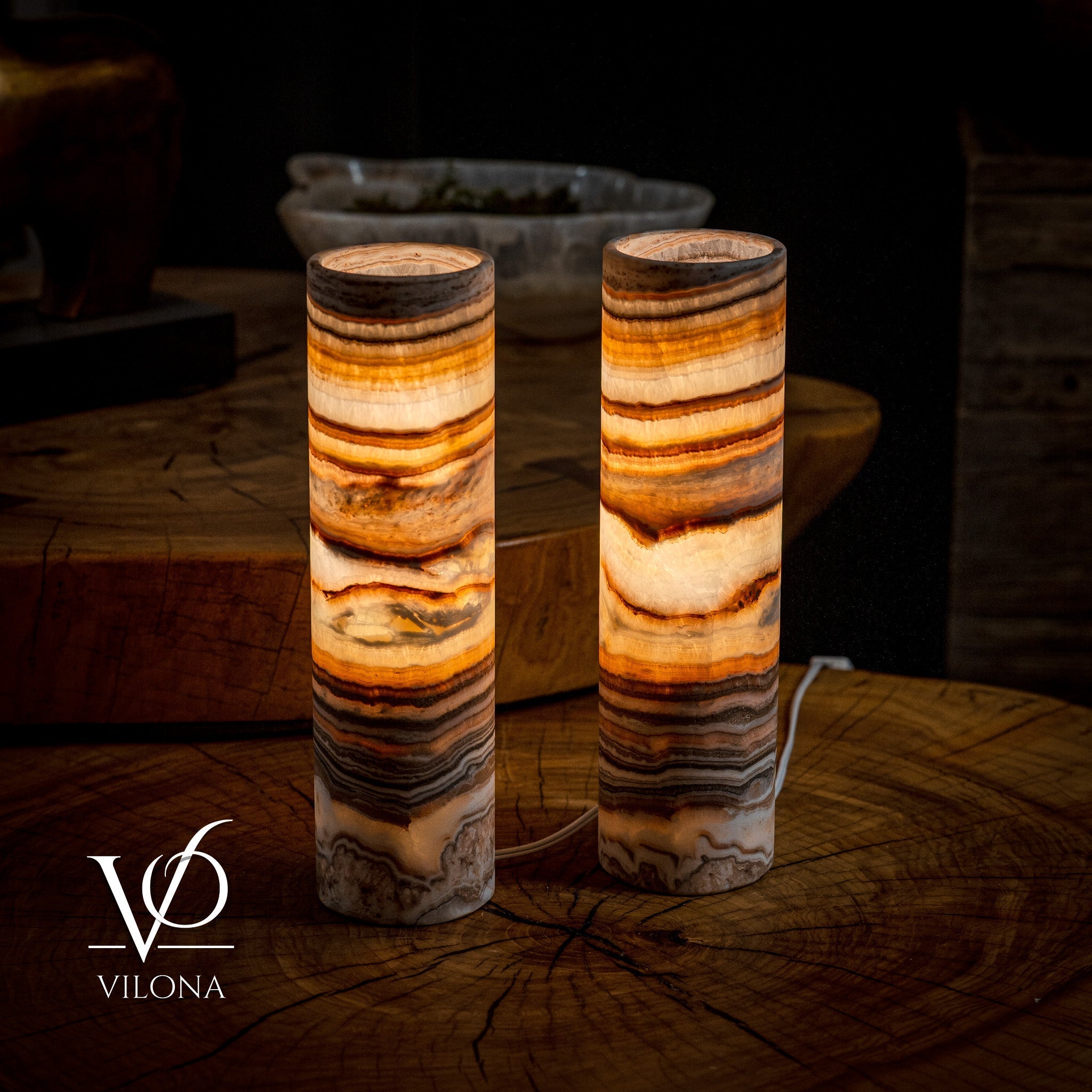 Pair of Vilona Onyx Sahara Onyx desk lamps featuring cylindrical design and warm glow, perfect for modern table lighting.