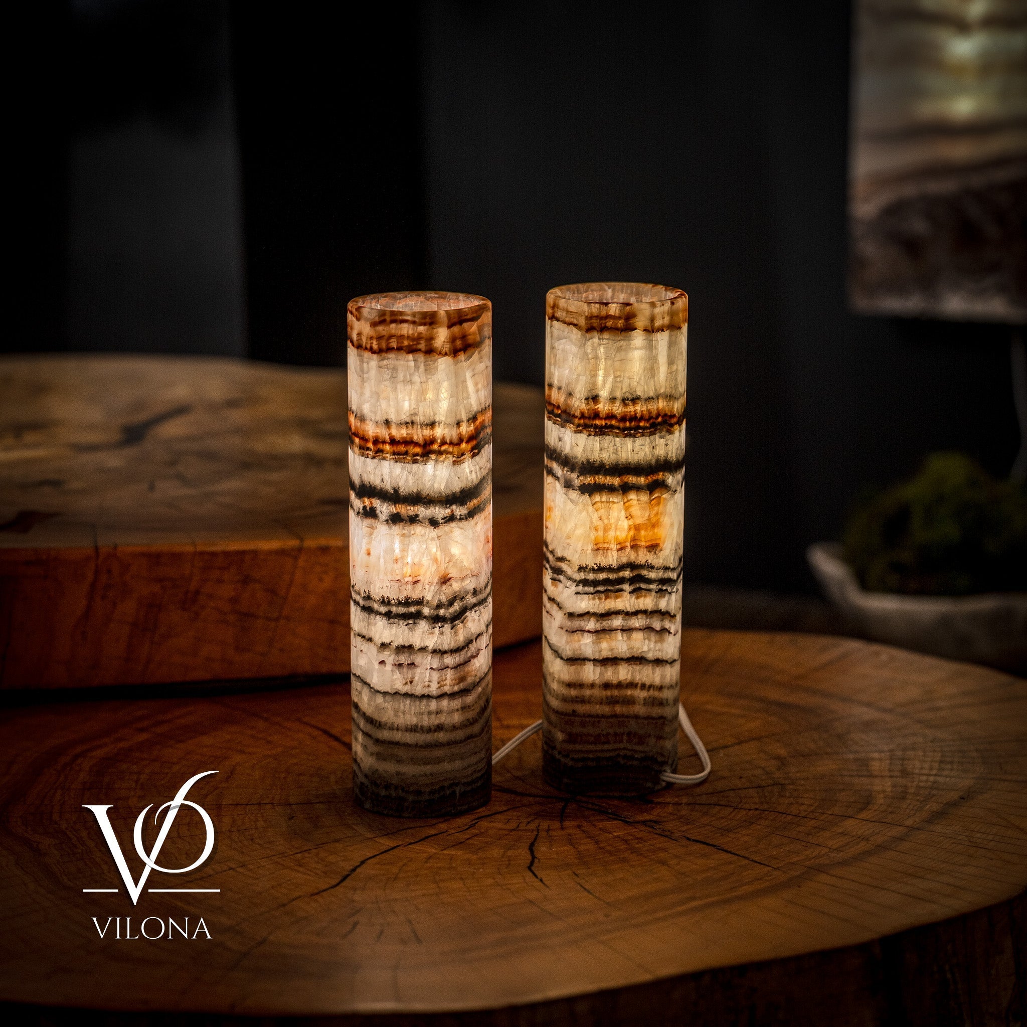 Pair of Vilona Onyx Tangerine Crystal desk lamps with sleek black bases and vibrant orange crystal shades, designed for elegant lighting.