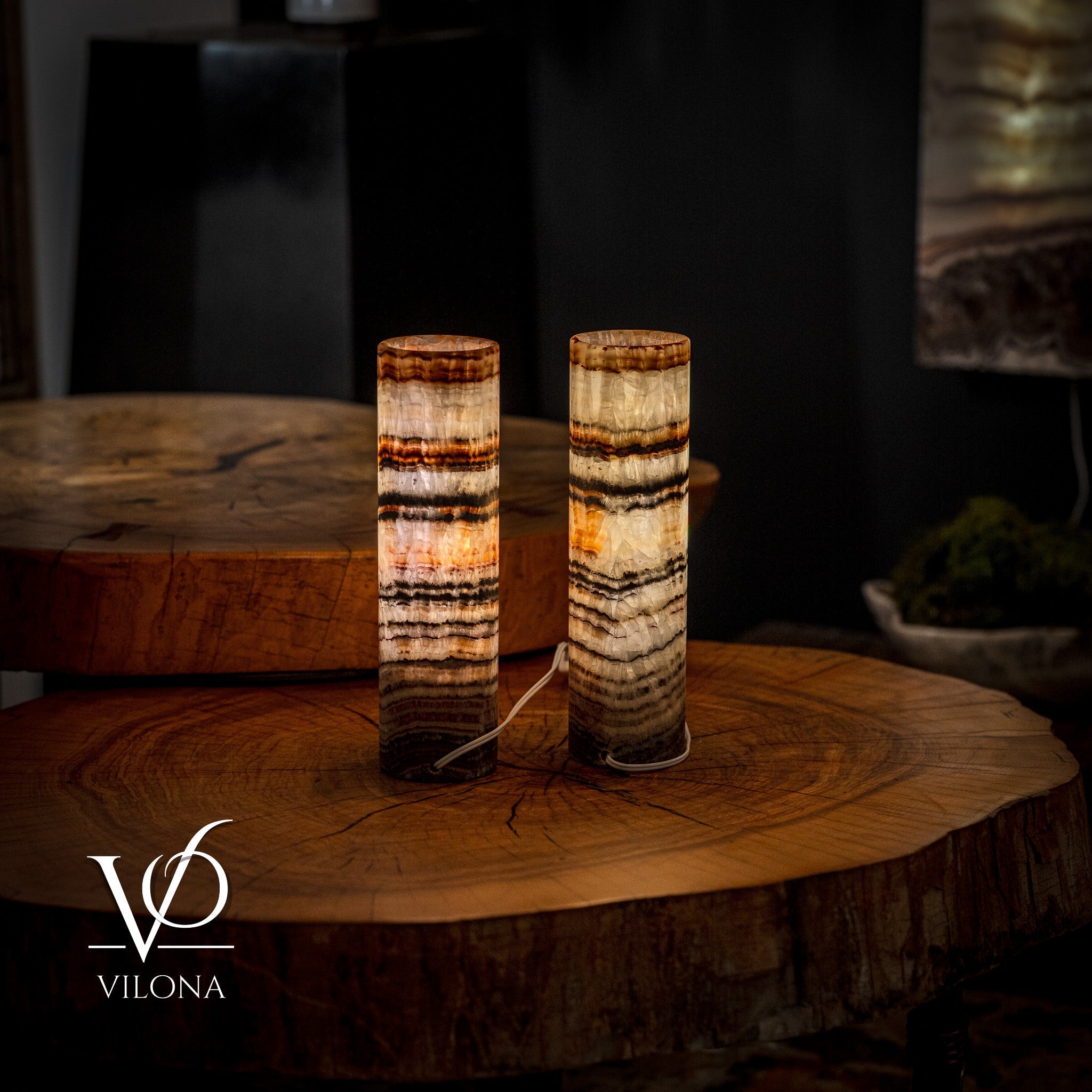 Pair of Vilona Onyx Tangerine Crystal desk lamps featuring vibrant orange onyx bases and elegant design.