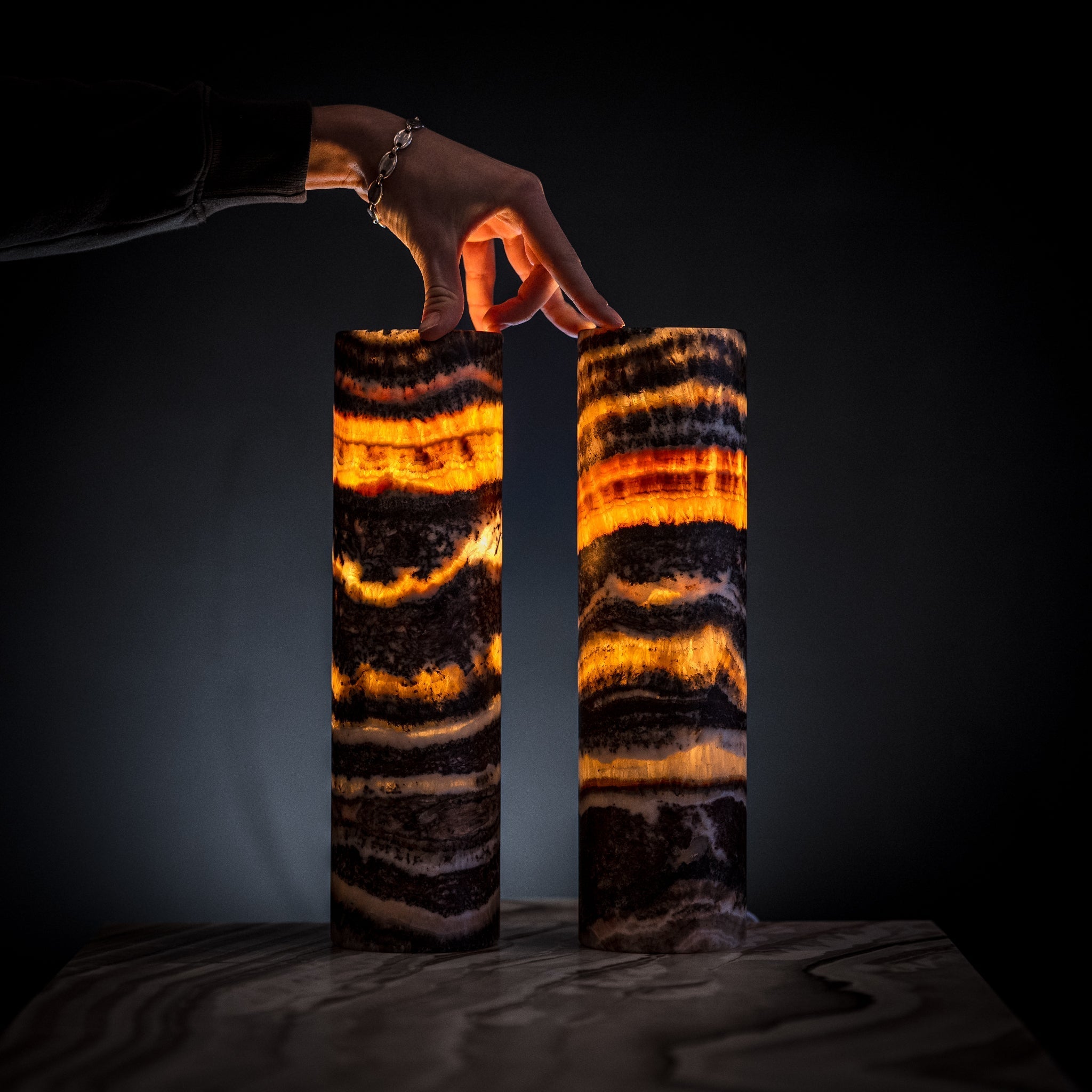 Pair of Vilona Onyx Tangerine Crystal desk lamps featuring vibrant orange crystal accents and sleek black bases.
