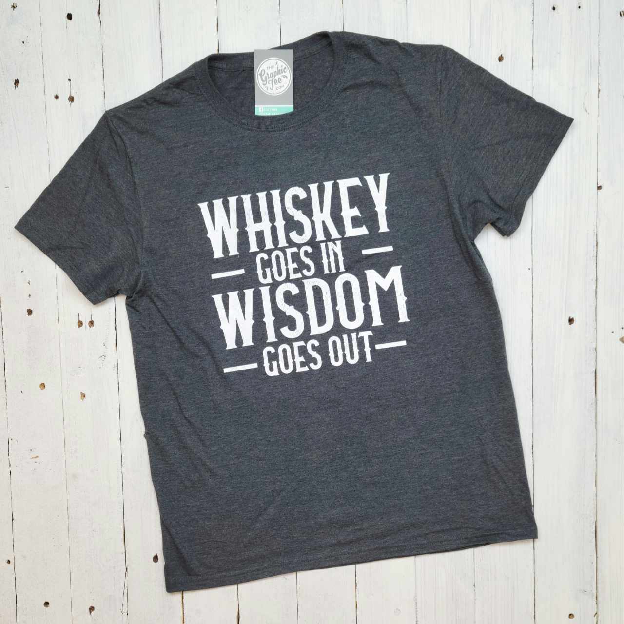 Adult SS graphic tee featuring the "Whiskey Goes In Wisdom Goes Out" design by The Graphic Tee, casual wear for whiskey lovers.