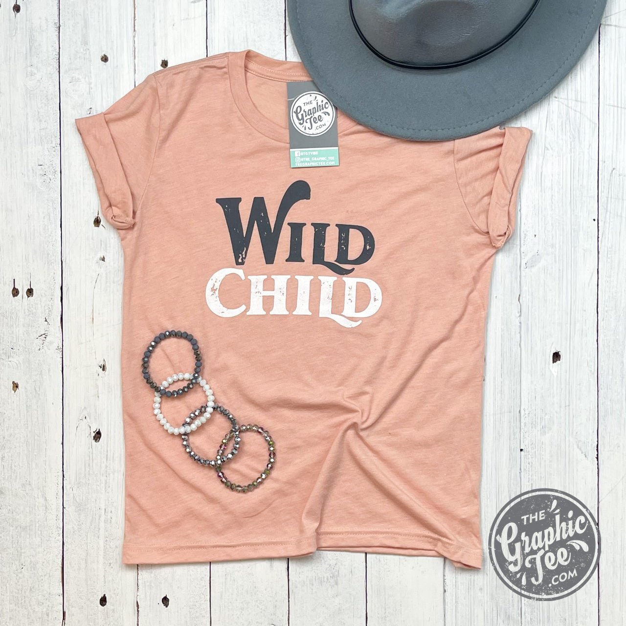 Youth graphic T-shirt by The Graphic Tee featuring a wild child design, casual fit, and vibrant colors for kids.